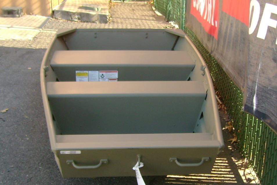 2026 Tracker Grizzly 10 Jon boat, parked outdoors, showcasing interior seating and sturdy design.