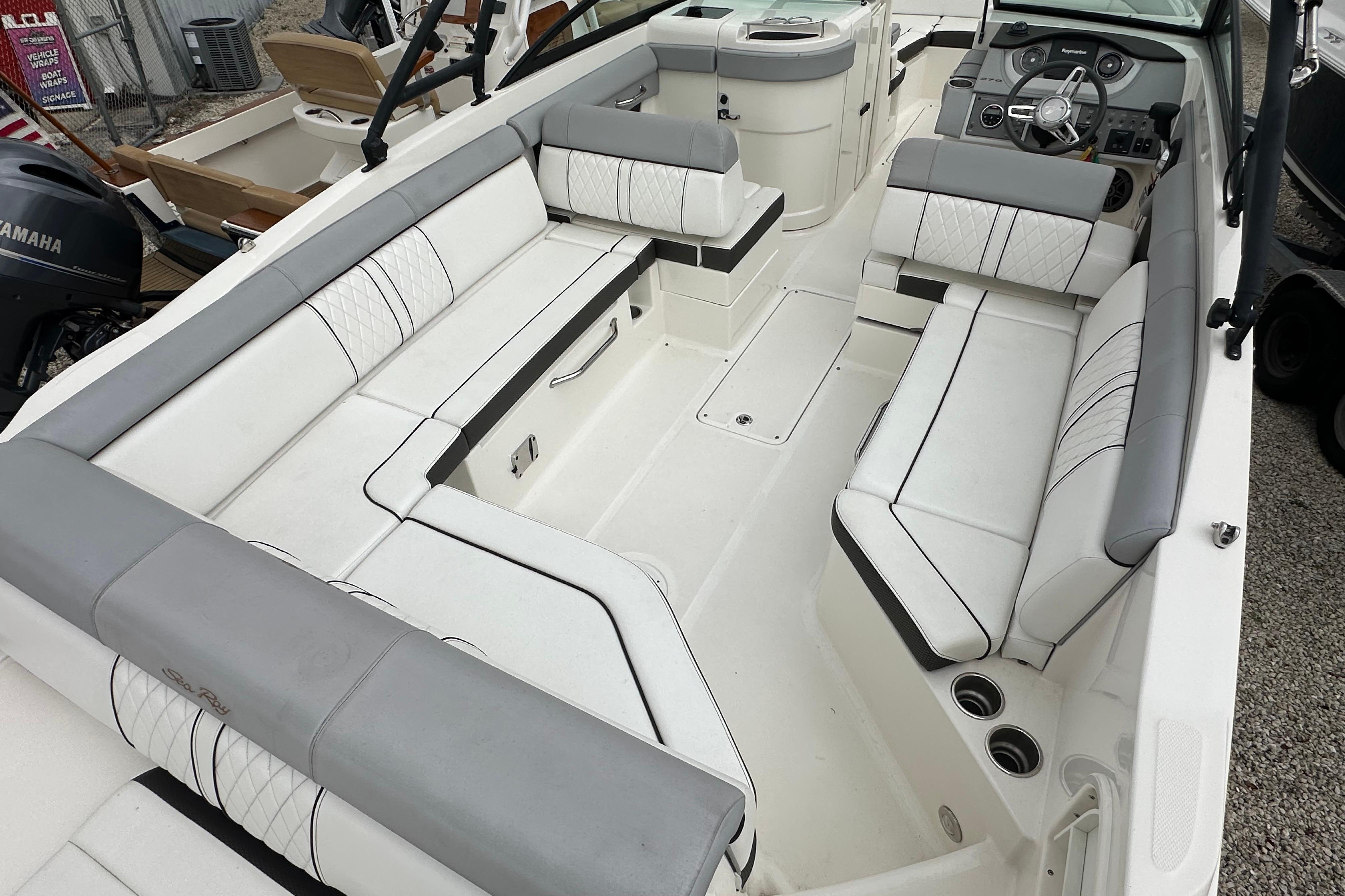 2016 Sea Ray 270 Sundeck interior with spacious seating and modern dashboard.