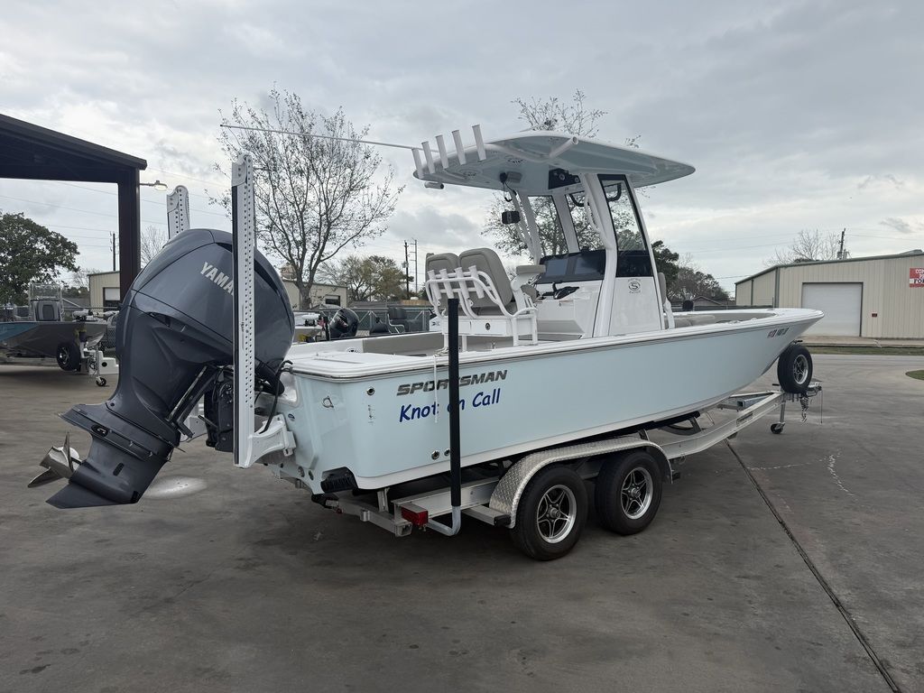 A 2025 Sportsman Masters 247OE Bay Boat on a trailer. It features a Yamaha outboard motor.