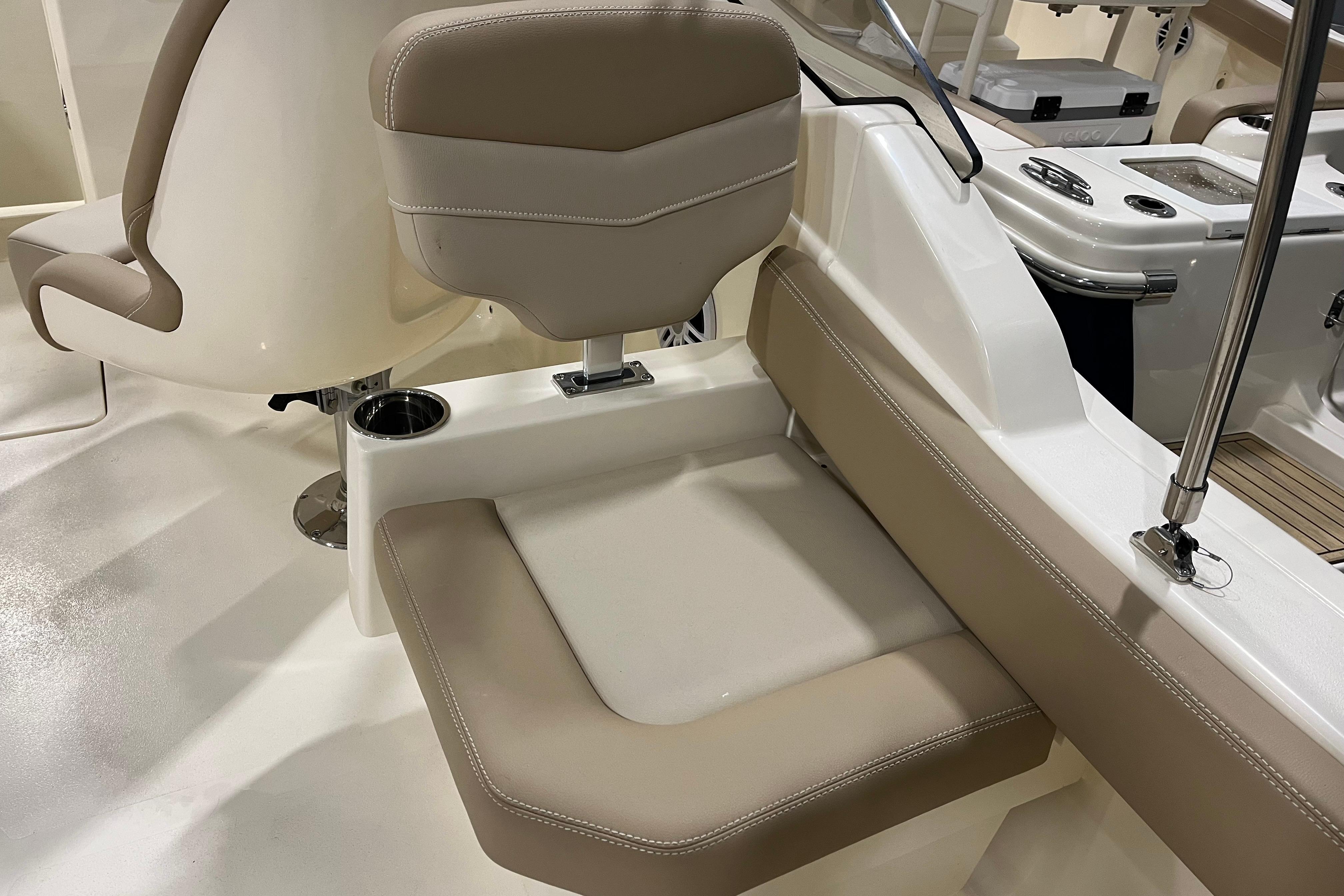 2025 Scout 215 Dorado boat interior with beige seating and cup holder.