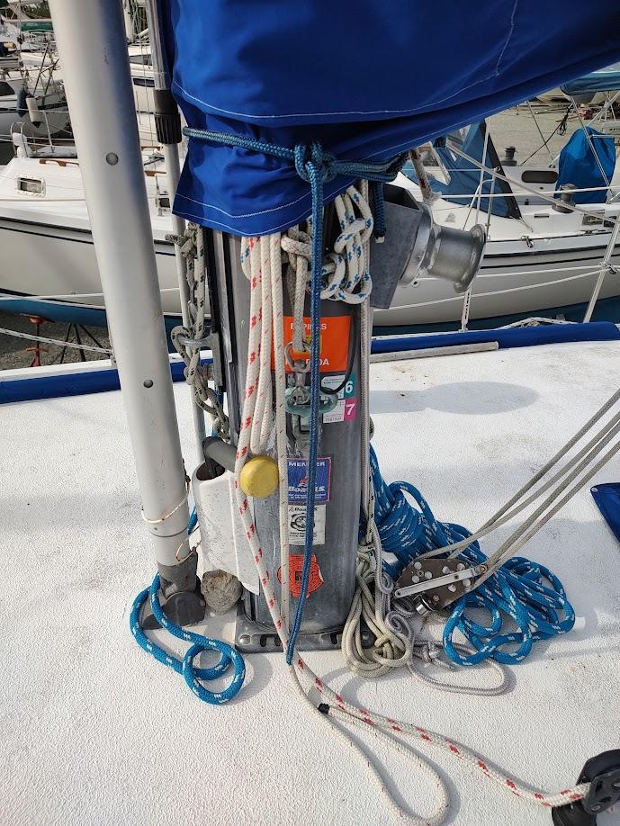 Mast base of 1981 Bruce Roberts 450 sailboat with ropes and winch.
