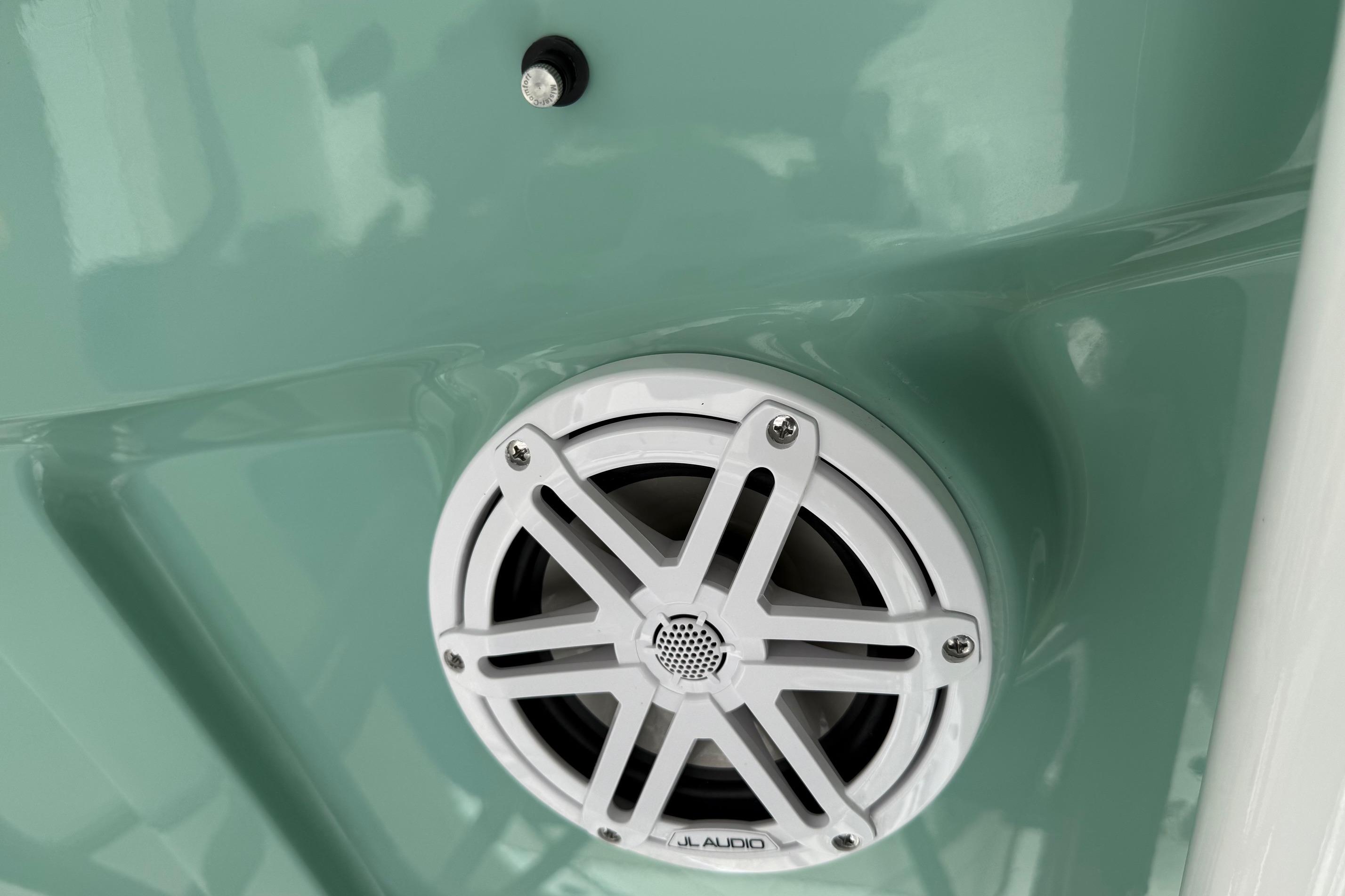 2026 Sea Hunt Ultra 229 boat speaker, JL Audio, mounted on light green surface.