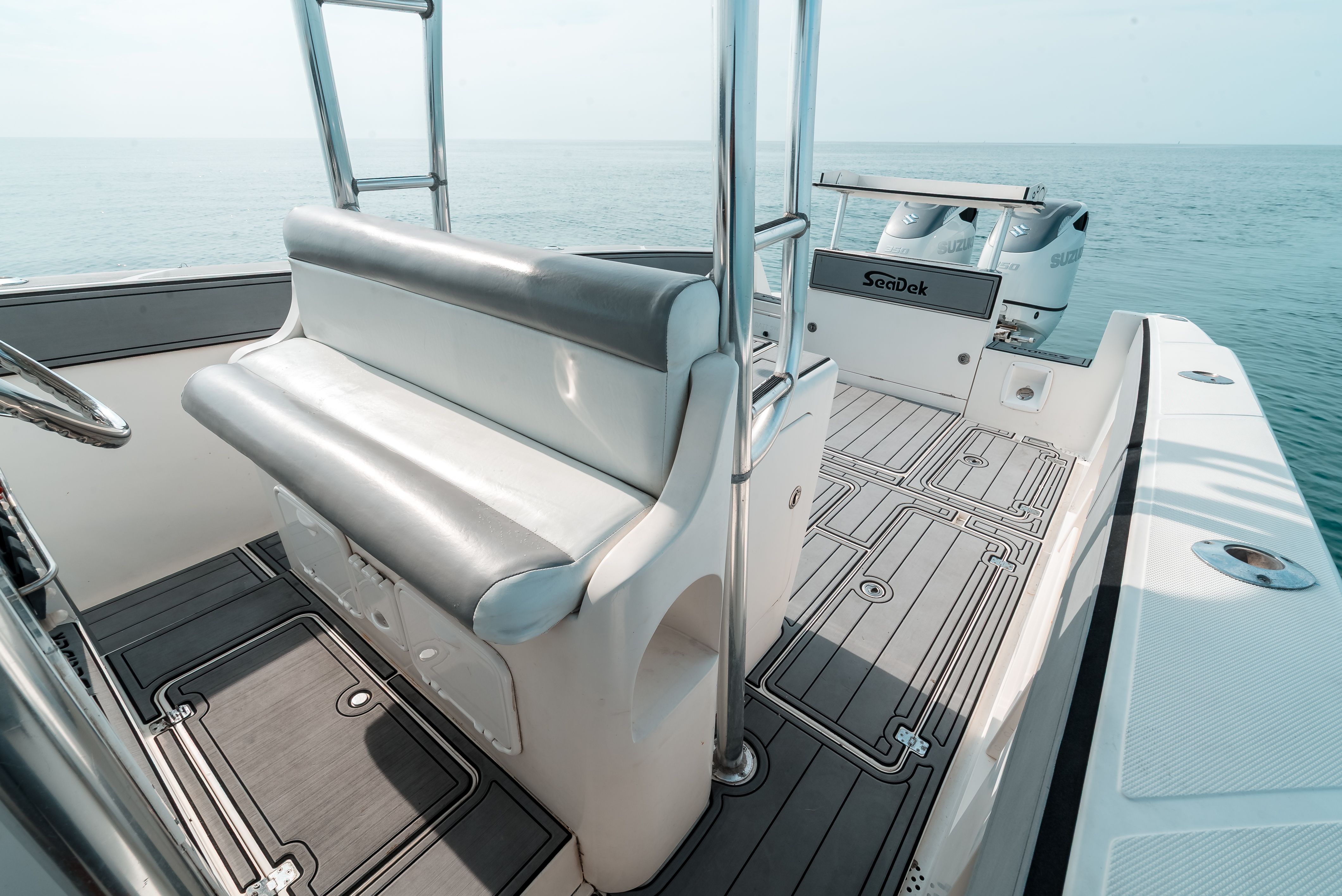 The image shows the deck of a 2006 Tempest Offshore 40 boat on calm water.