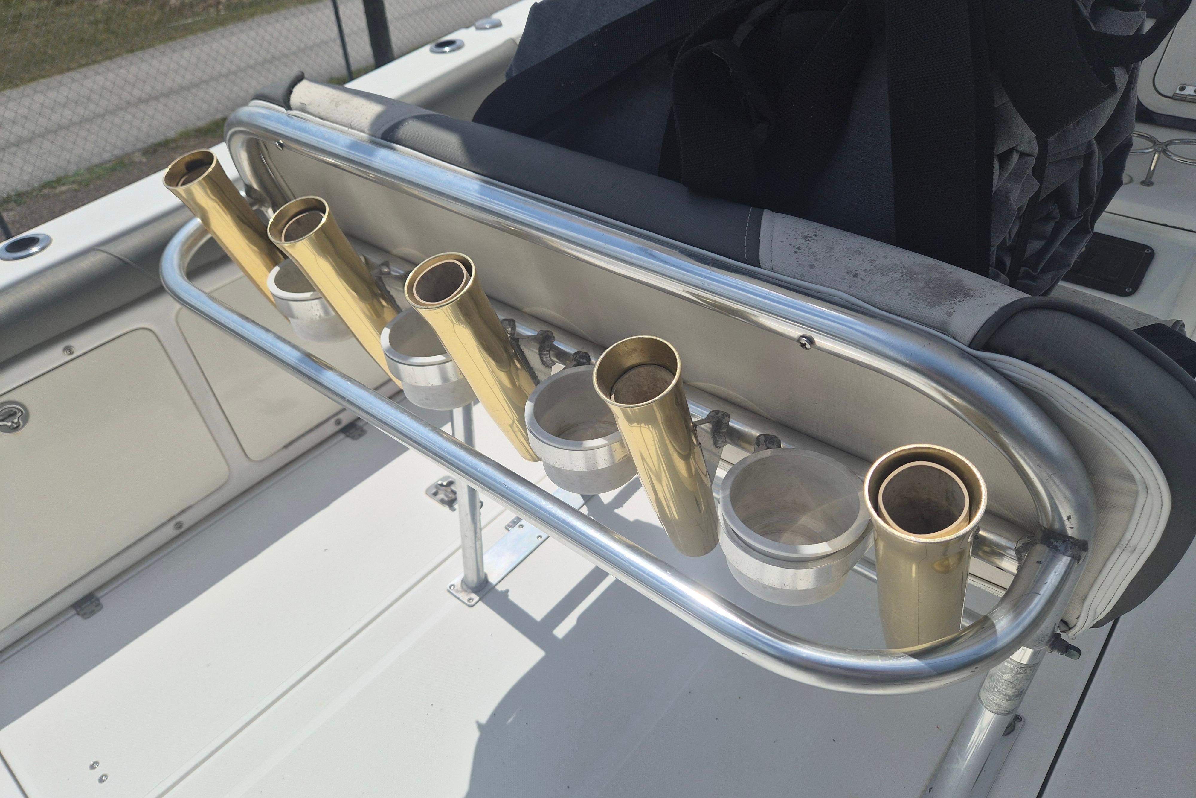 Rod holders on a 2006 Century 2900 Center Console boat deck.