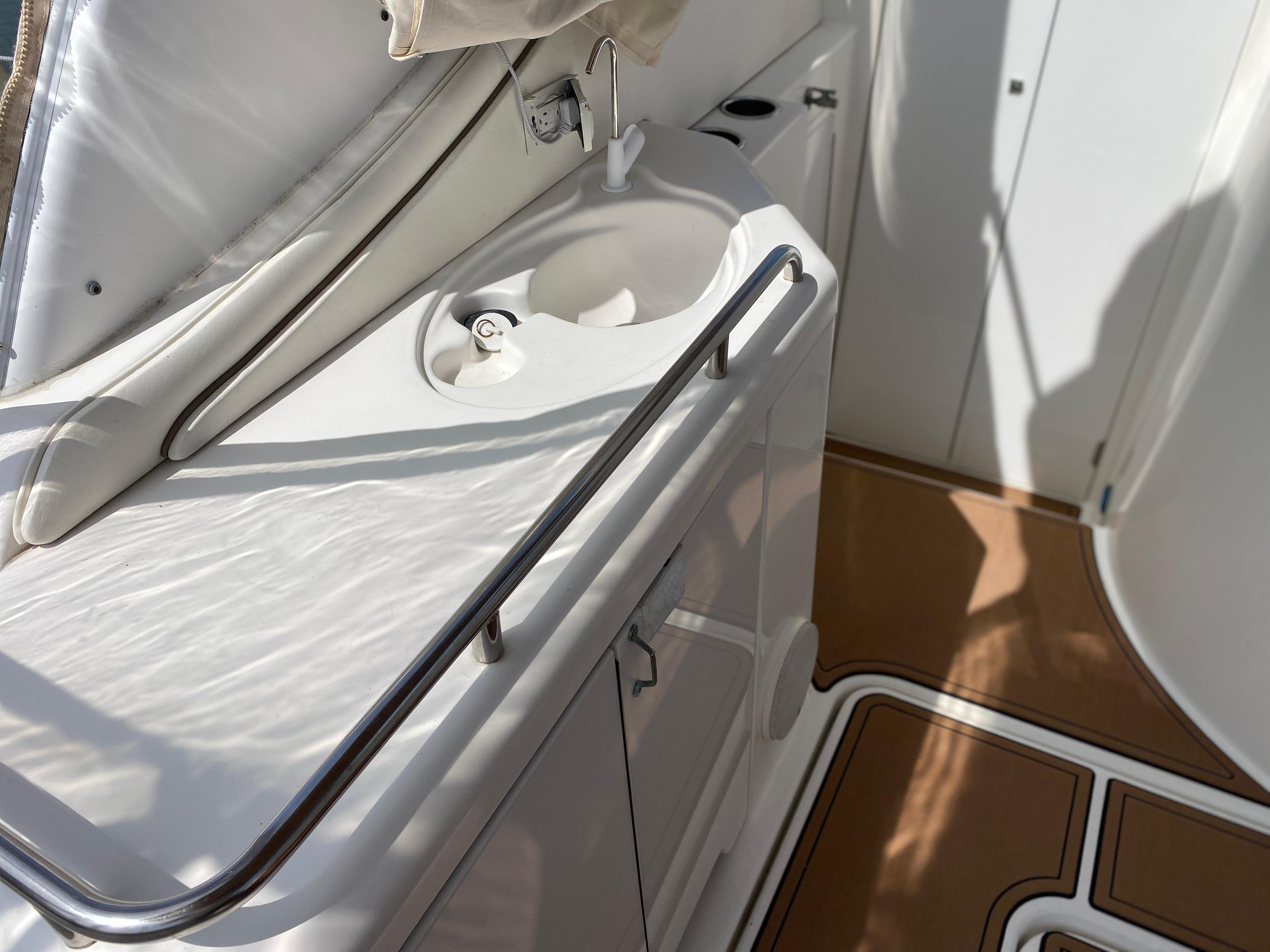 2000 Cruisers 3672 yacht interior with sink and storage area.