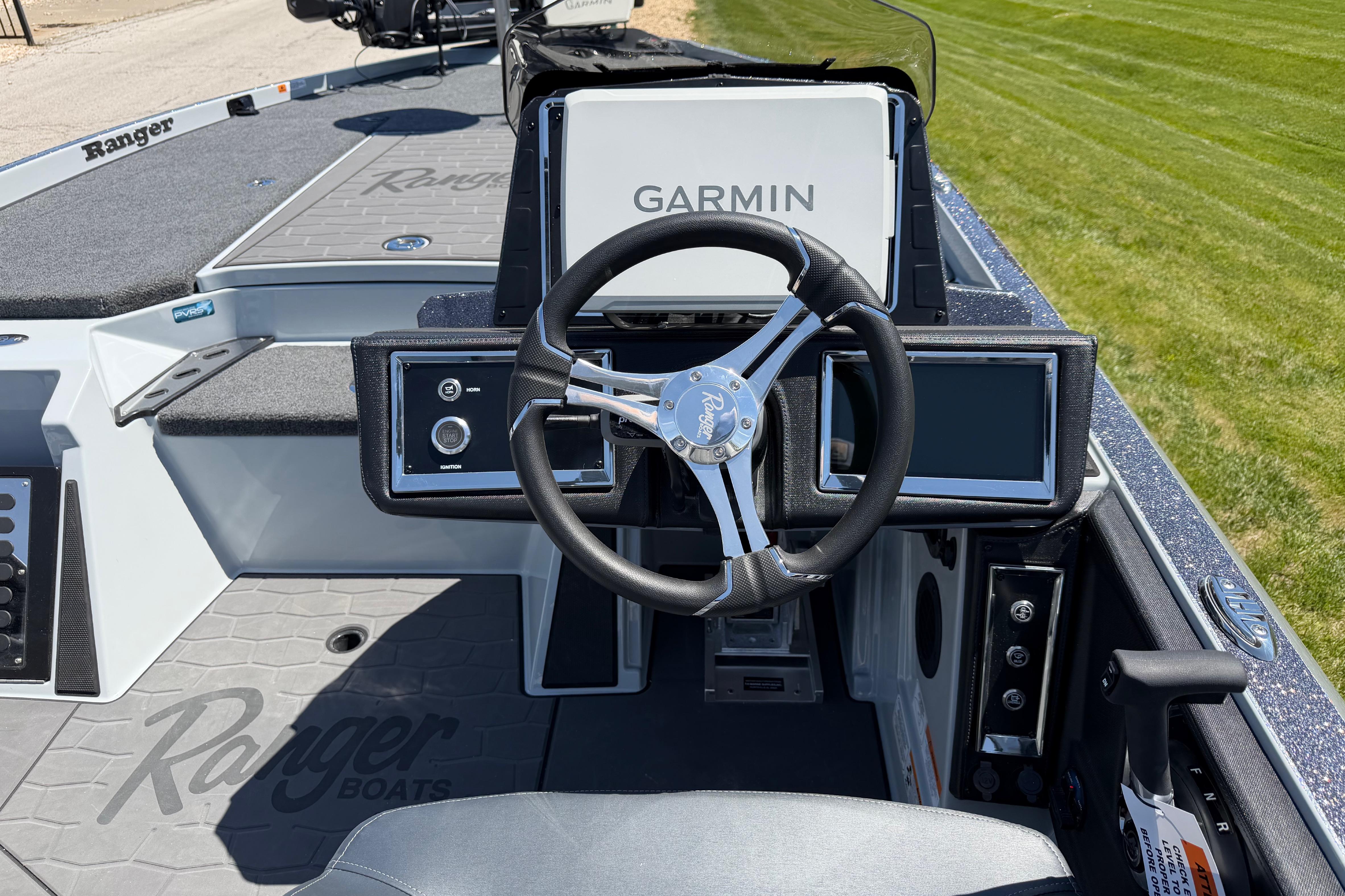 2026 Ranger Z520R boat cockpit with Garmin navigation system and sleek steering wheel design.