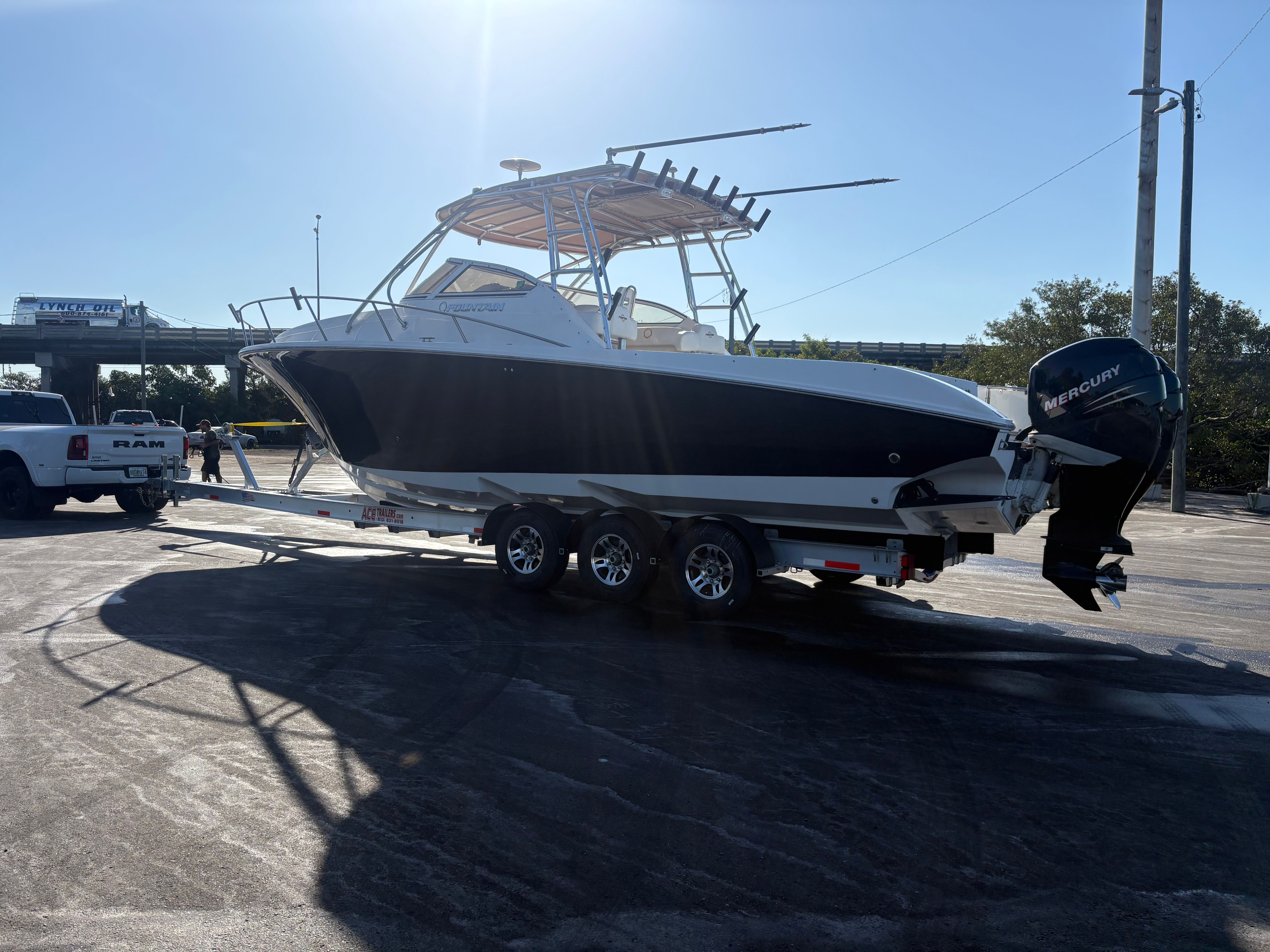 2009 Fountain 33 Sportfish Cruiser on trailer outdoors.