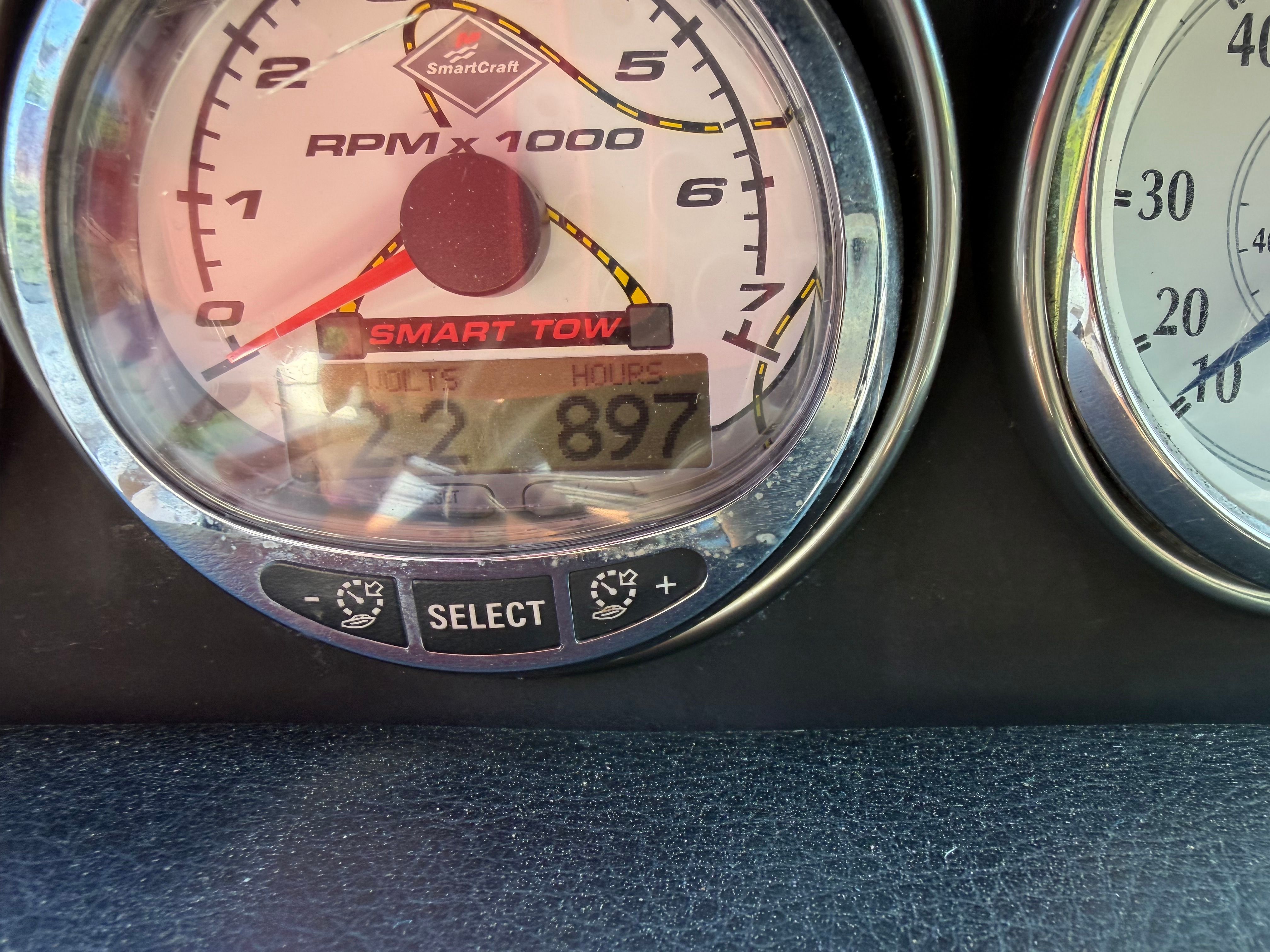 Close-up of a tachometer with SmartCraft logo and Smart Tow display.