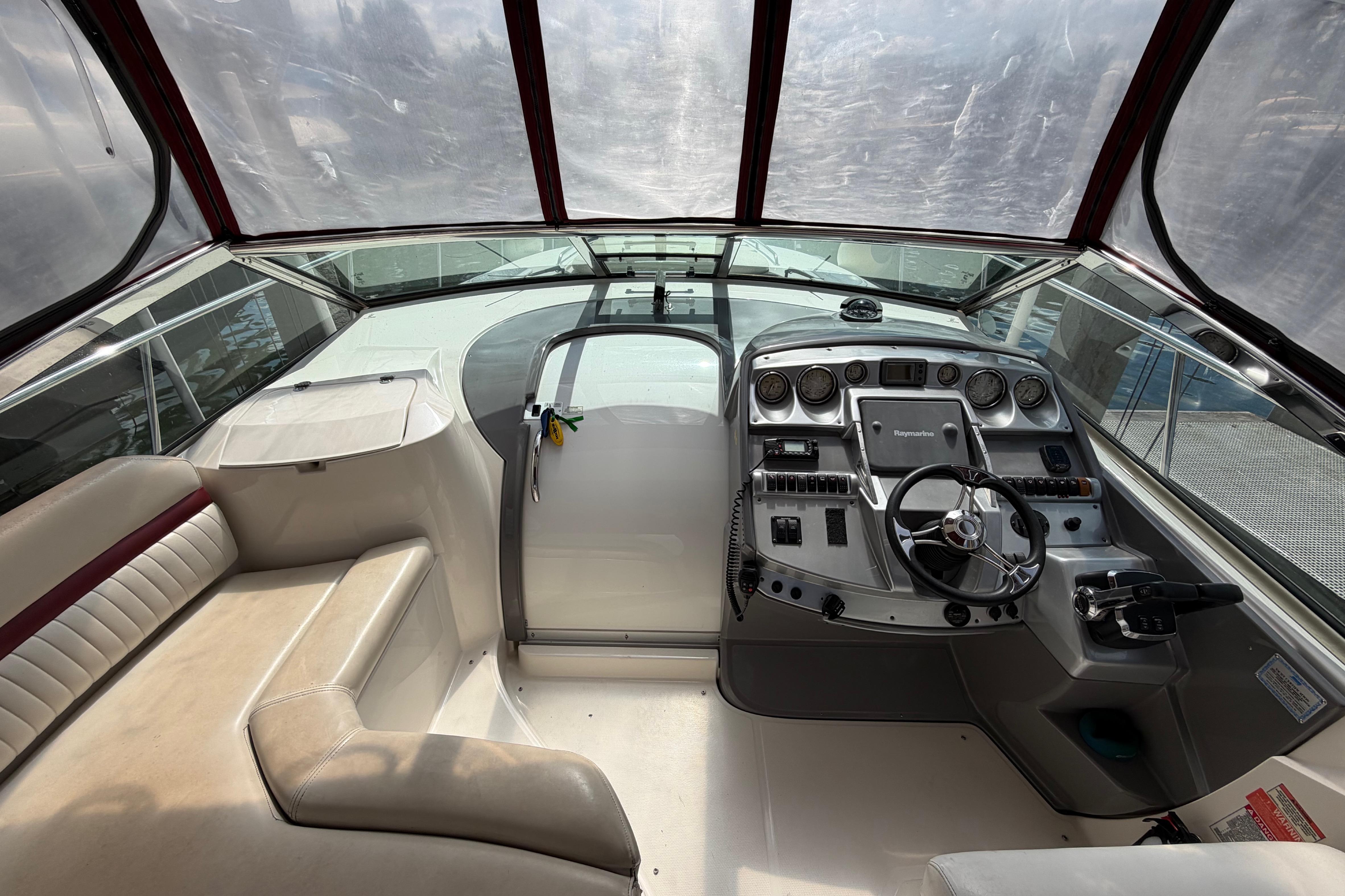2007 Monterey 350 Sport Yacht cockpit with steering wheel and control panel.