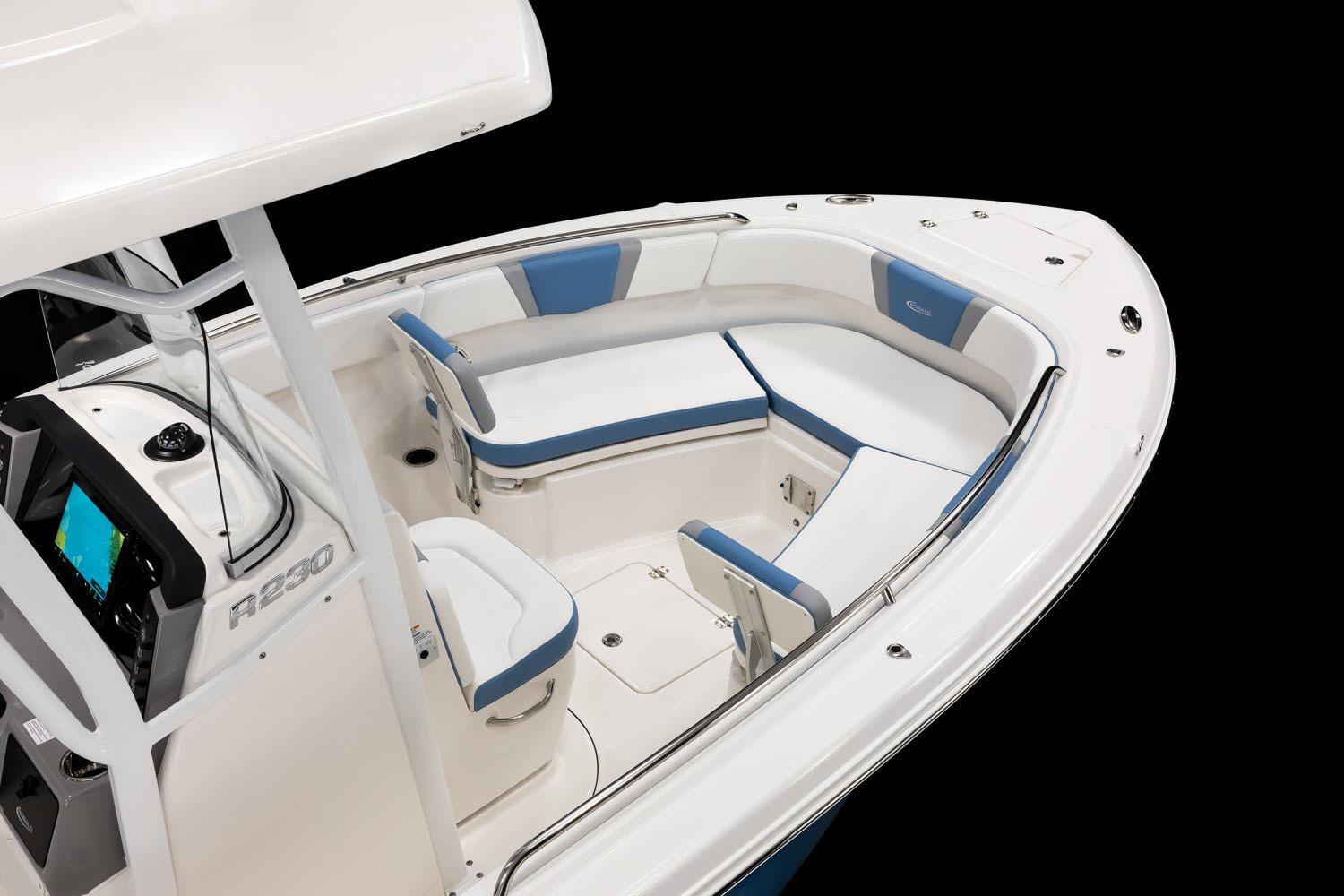 Manufacturer Provided Image: 2026 Robalo R230 Center Console boat interior with blue and white seating.