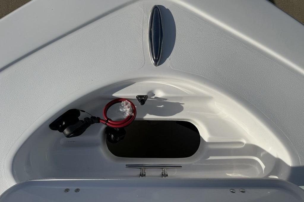 2026 Tidewater 198 CC Adventure boat storage compartment with red cable and cleat.