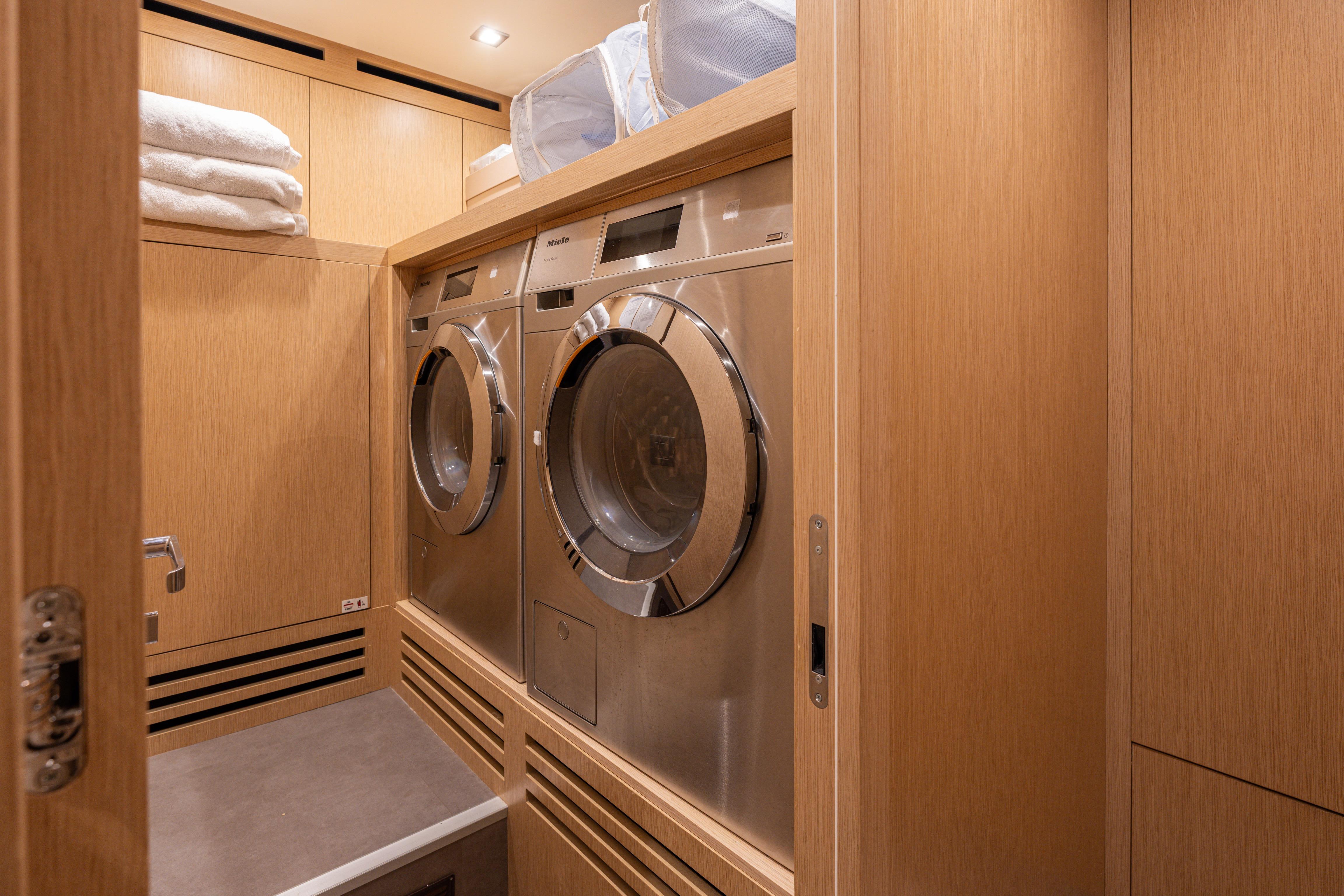 Laundry room with modern appliances on 2023 Sanlorenzo SL120A yacht.