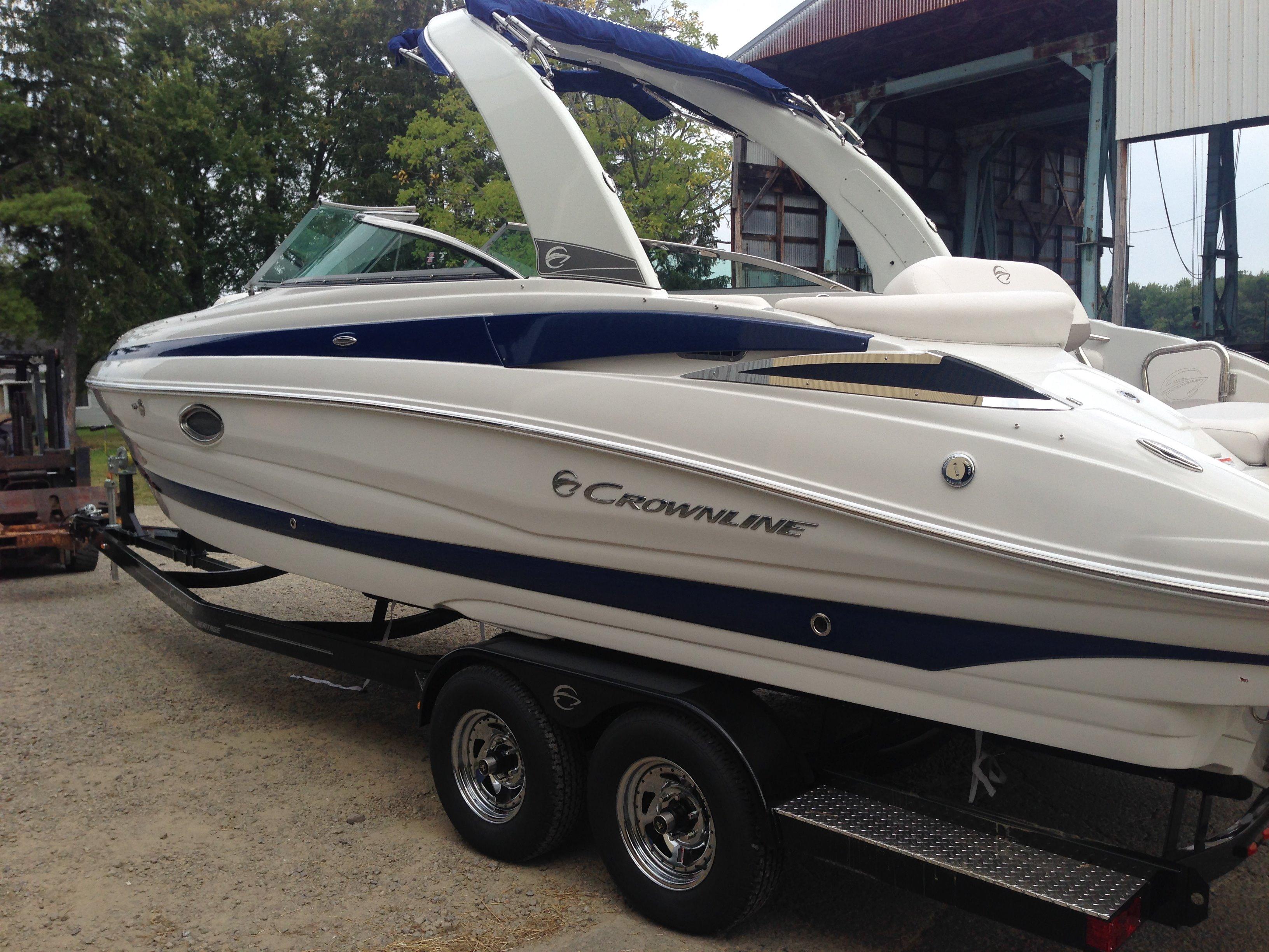 2016 Crownline 285 SS boat on trailer, side view.