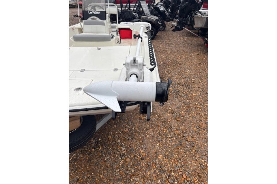 2026 Mako Pro Skiff 17 CC boat with trolling motor on gravel surface.