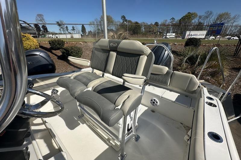 2026 Key West 219 FS boat interior with cushioned seating and steering wheel.