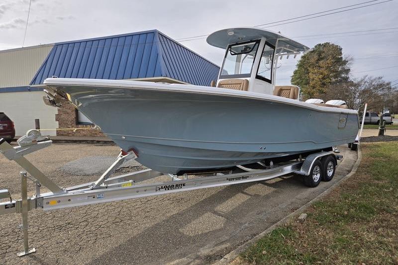 2026 Sea Hunt Ultra 275 Coffin Box boat on trailer, parked outdoors.