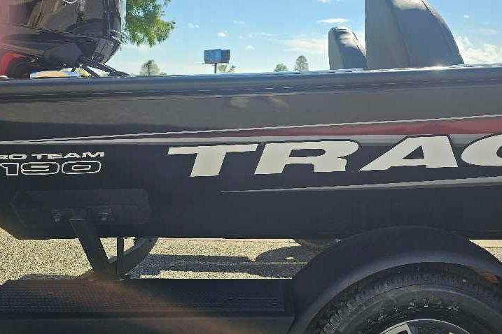 2026 Tracker Pro Team 190 boat side view with logo and trailer.