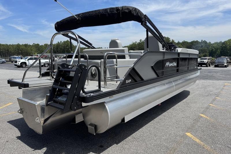 2026 Manitou Encore 25 SL SHP pontoon boat in parking lot, rear view.