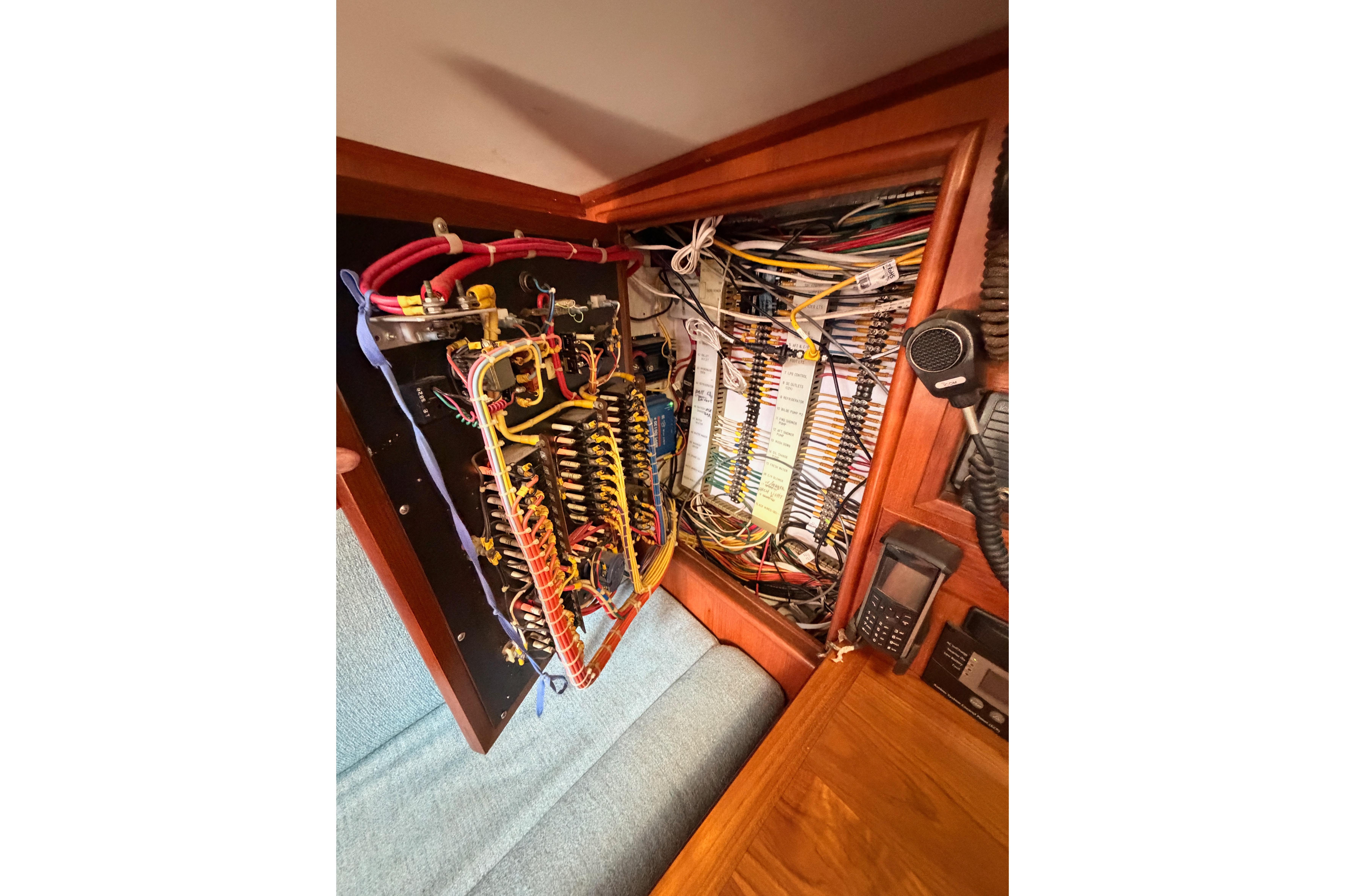 Electrical panel of a 1991 Hylas 51 yacht, showcasing intricate wiring and components.