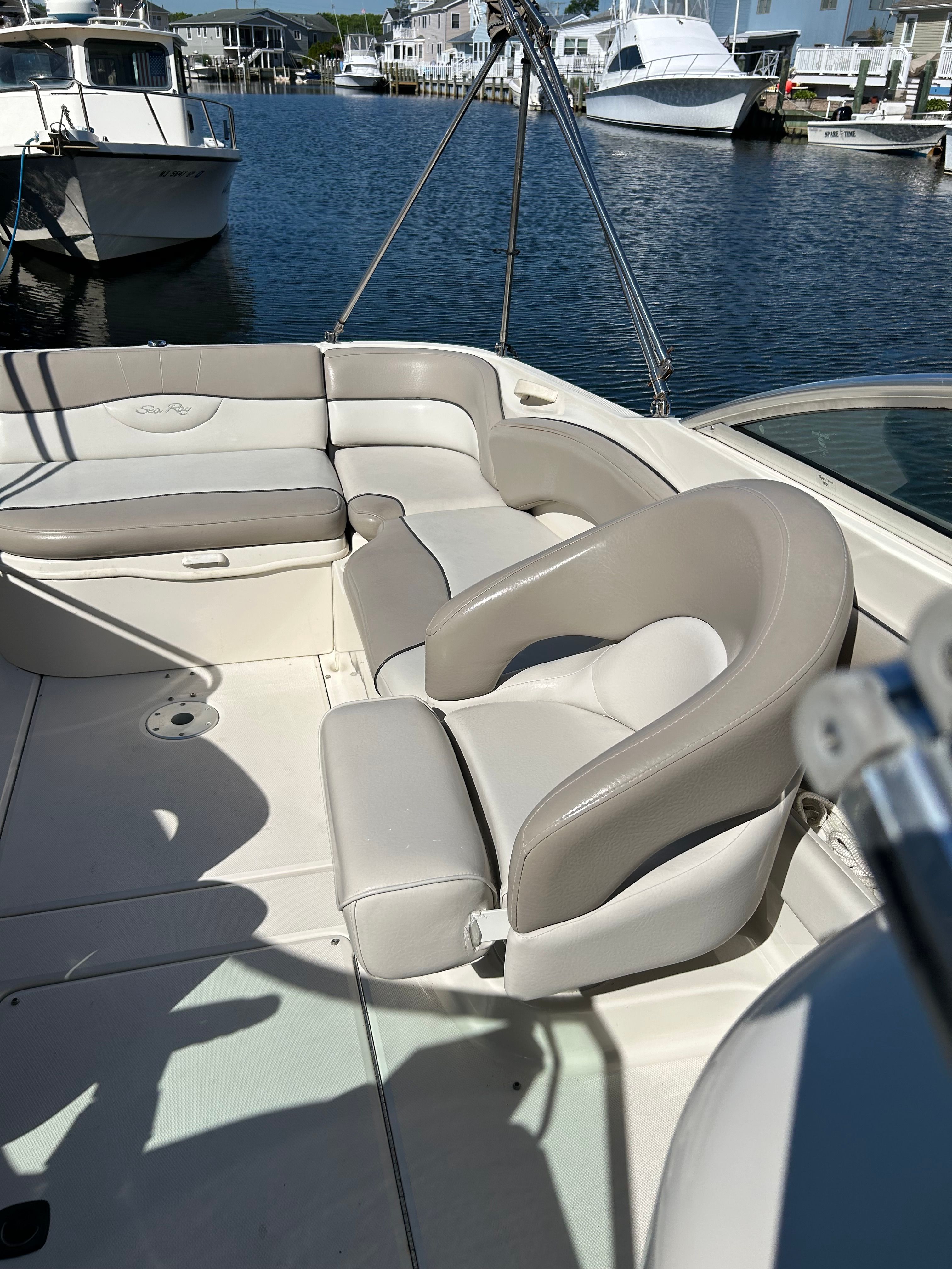 Interior of a 2003 Sea Ray 240 Sundeck boat in harbor.