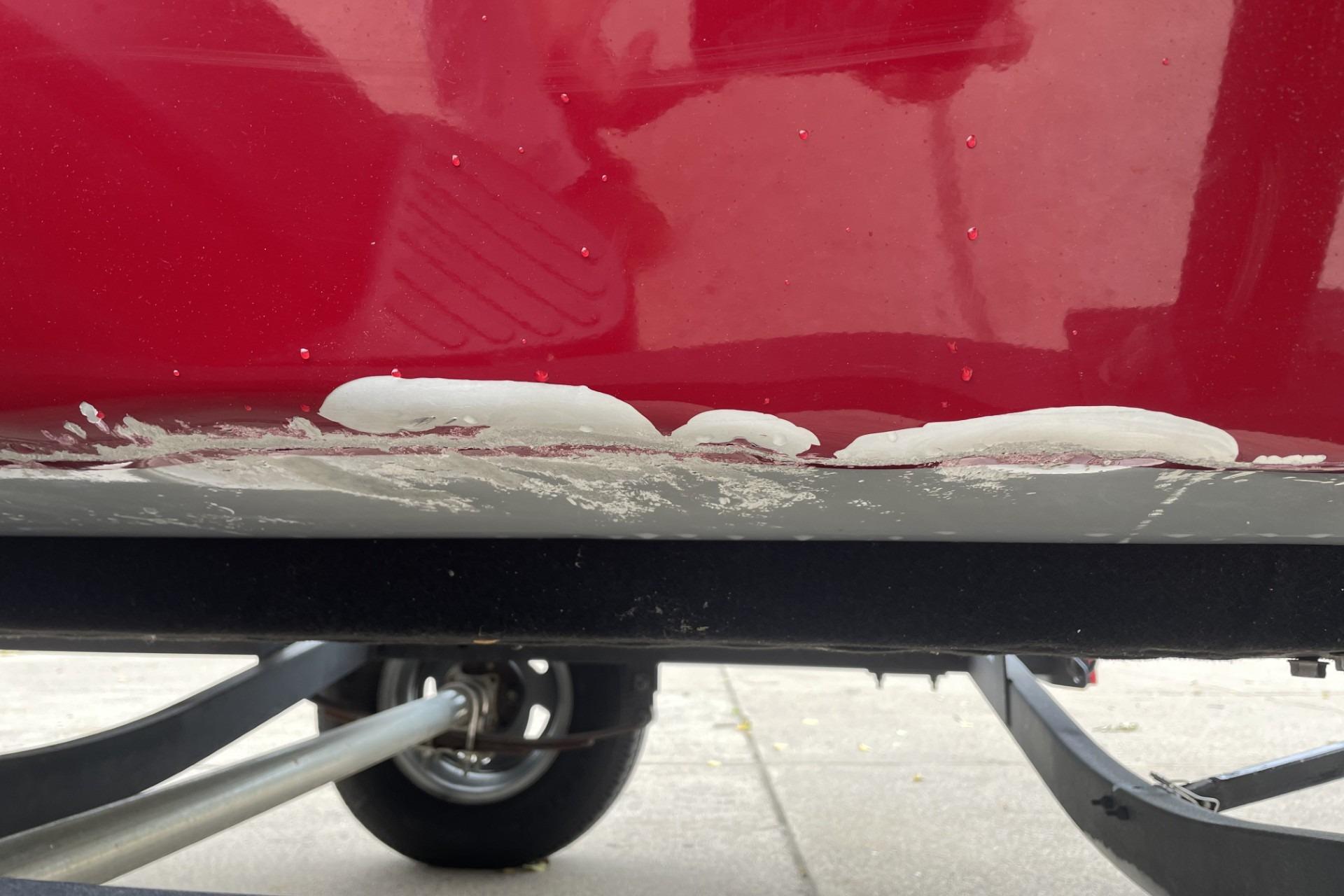 2022 Tracker Pro 170 boat with hull damage and visible repair patches.