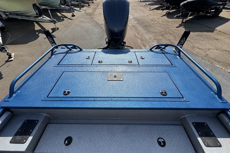 2026 SeaArk Dynasty 2.0 boat deck with blue finish and motor view.