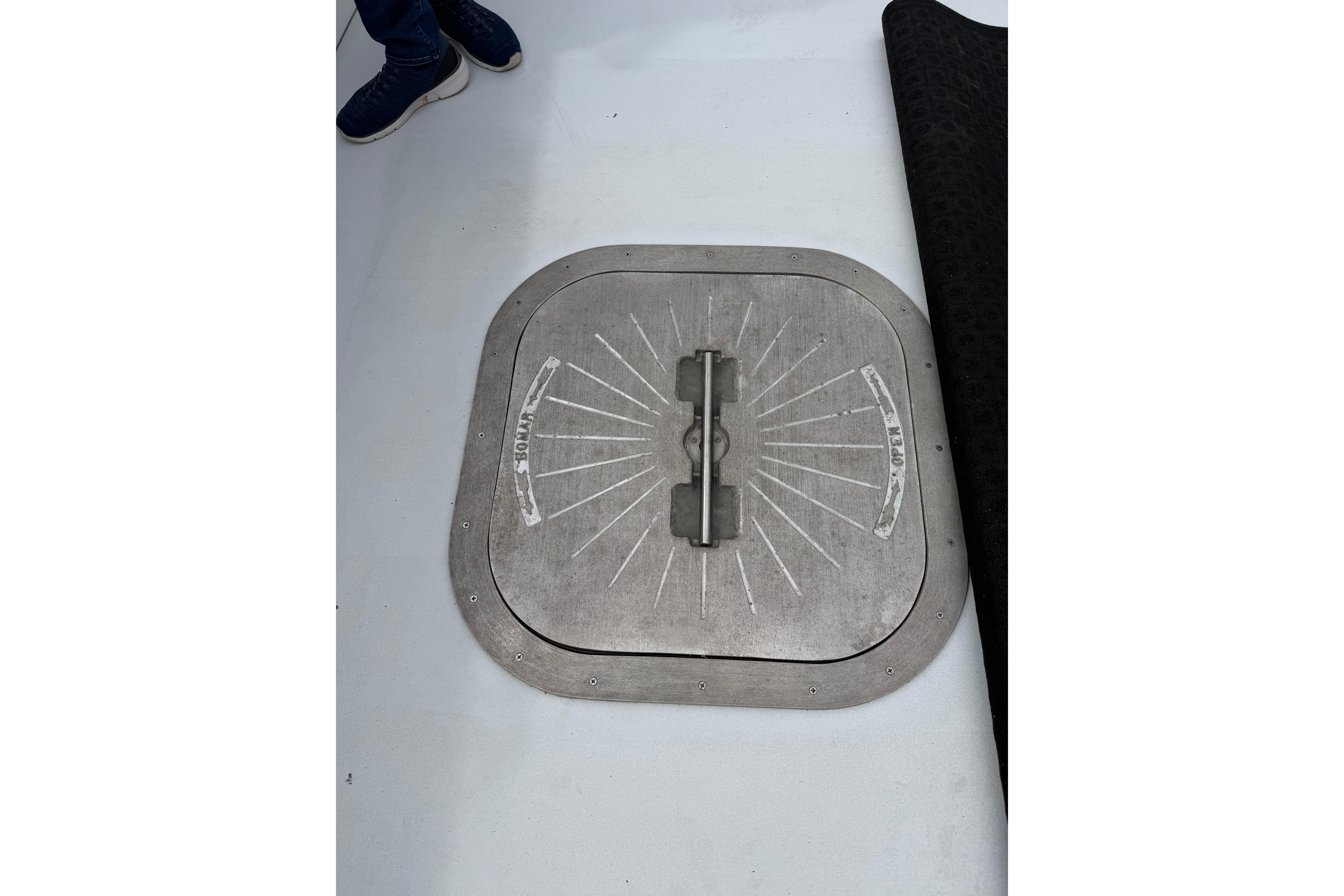 H&H Marine Osmond Beal 2018 boat hatch with metal handle on deck.