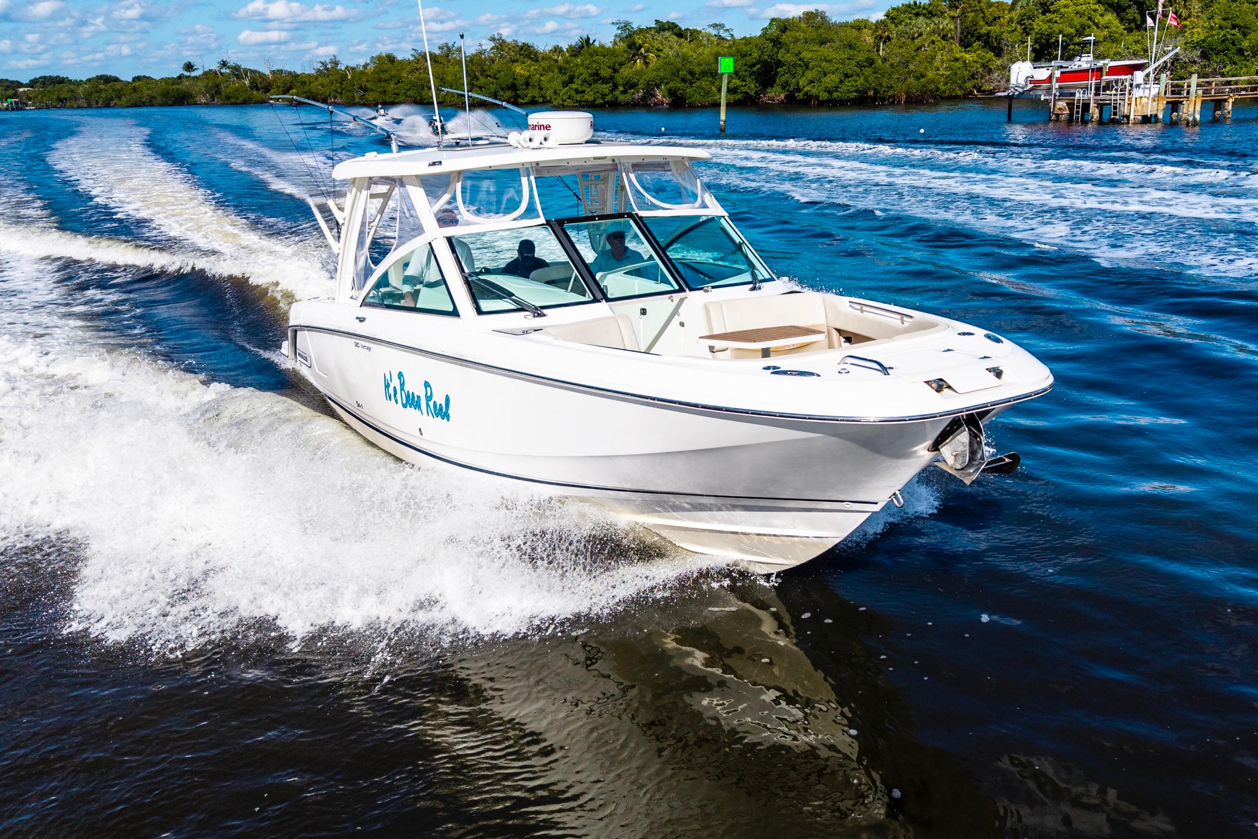 2019 Boston Whaler 320 Vantage cruising on a scenic waterway.