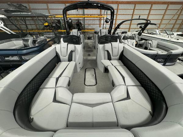 2025 Manitou LX pontoon boat interior with spacious seating and modern design.