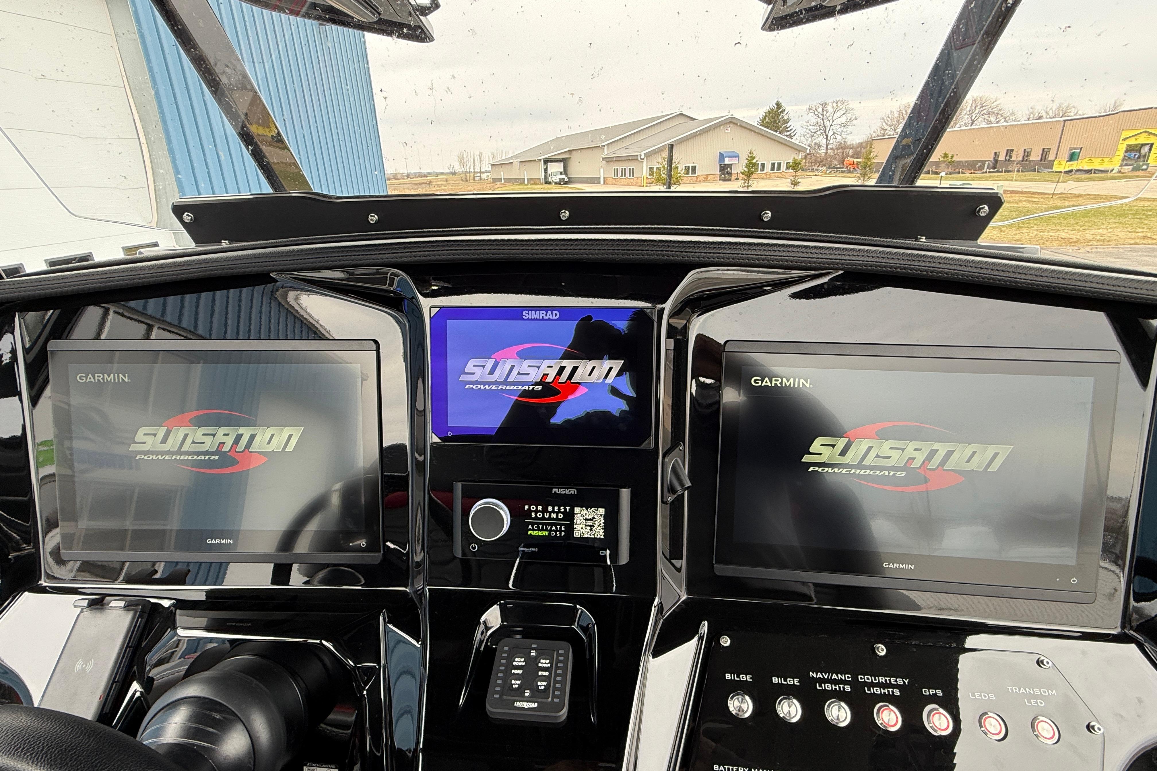 Dashboard of 2025 Sunsation 32 CCX boat with Garmin and Simrad displays.