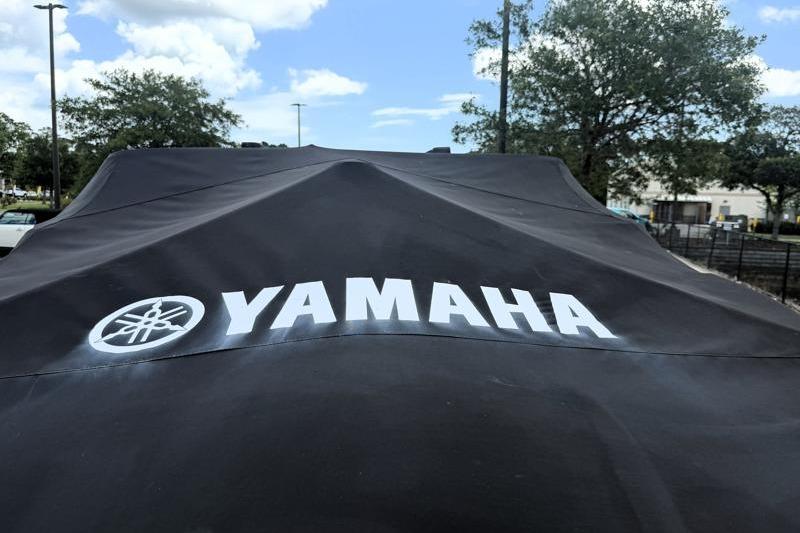 2017 Yamaha SX210 boat covered, displaying Yamaha logo outdoors.