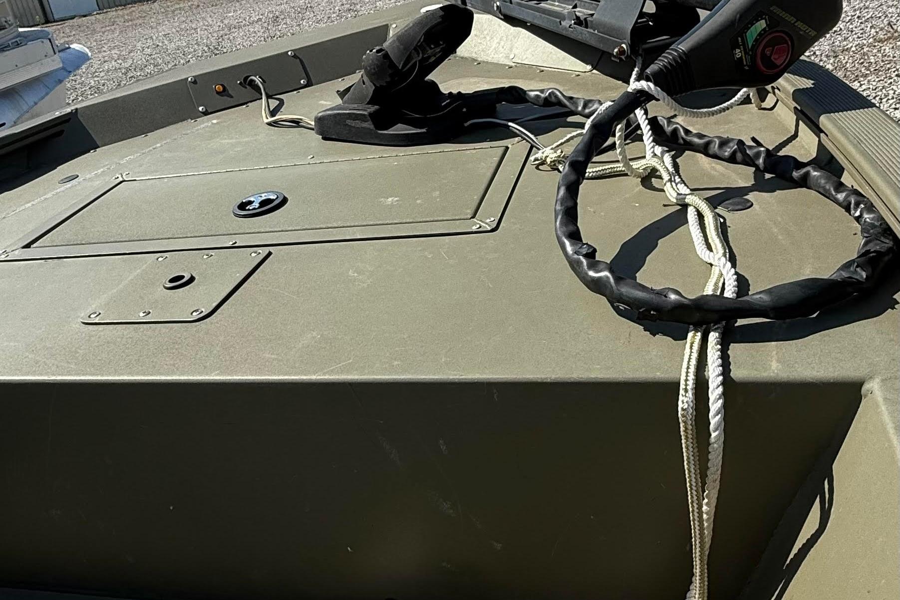 2019 Tracker Grizzly 1648 SC boat deck with ropes and equipment.