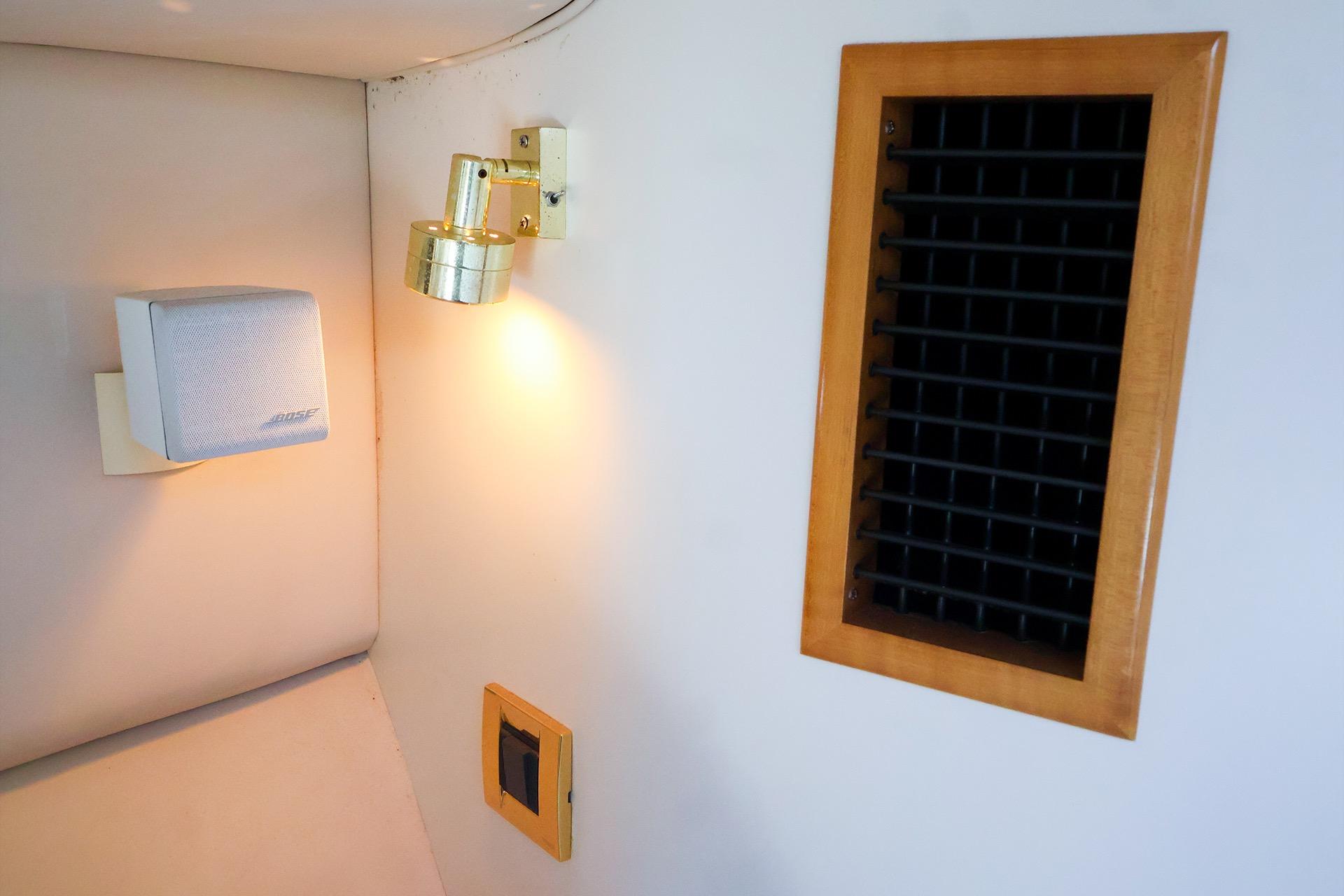 Interior of 1998 Sea Ray 500 Sundancer with speaker, light, and vent.