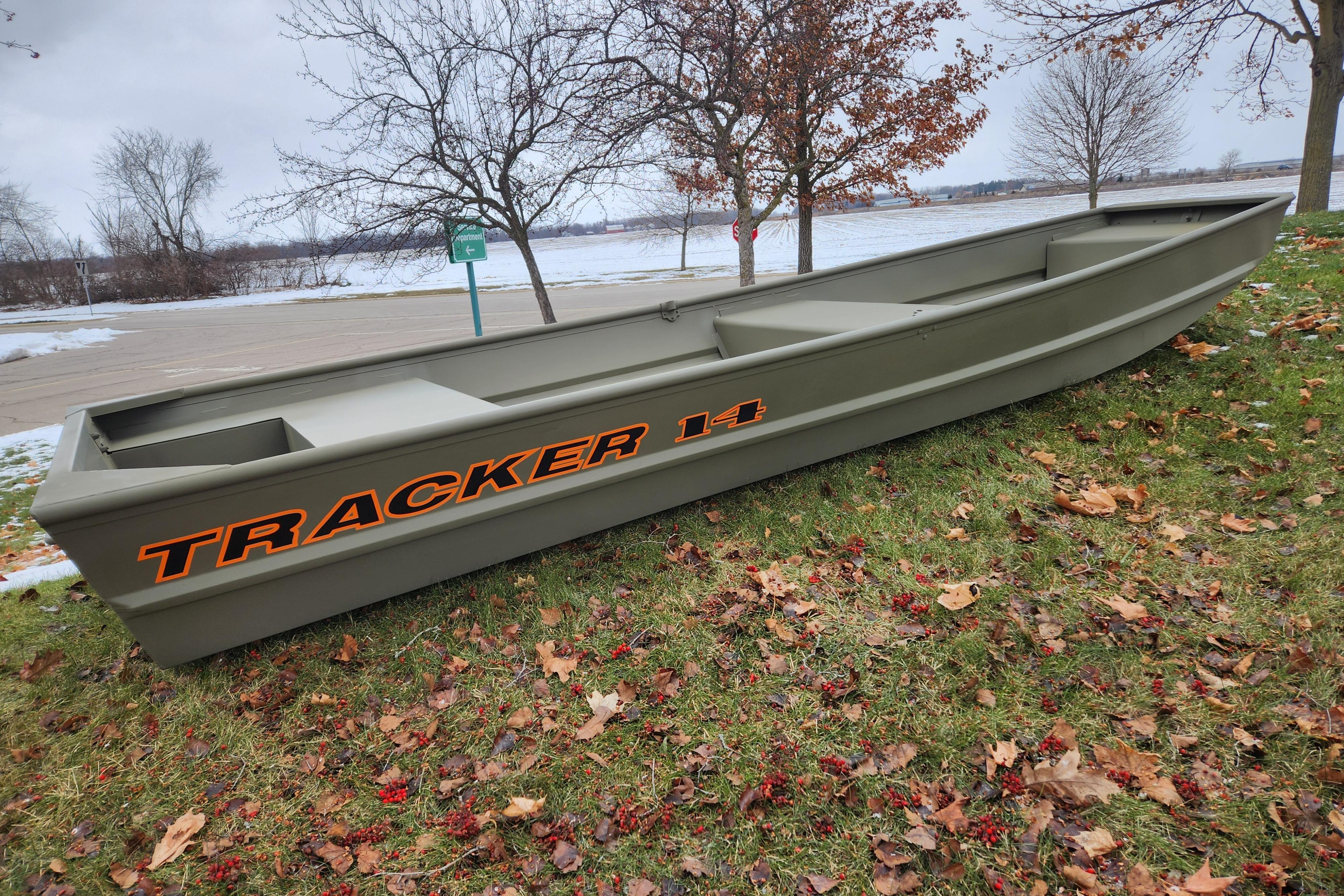 2026 Tracker Grizzly 14 Jon boat on grassy area with autumn leaves.