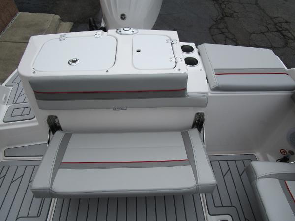 2025 Solara S-250 CW boat seating area with storage and cup holders.