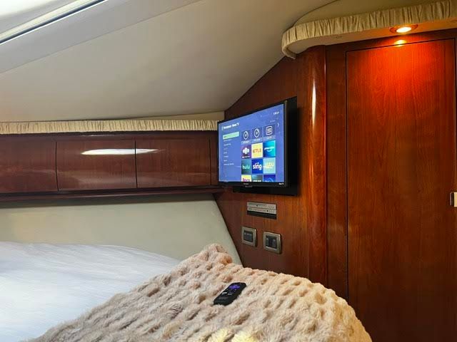 Luxurious cabin of 2006 Sea Ray 44 Sundancer with TV.