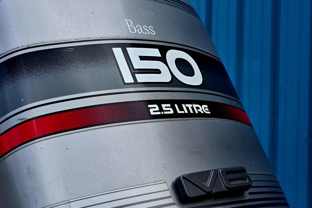 Close-up of a 1996 Champion 181 SX outboard motor, featuring "150" and "2.5 Litre" text.
