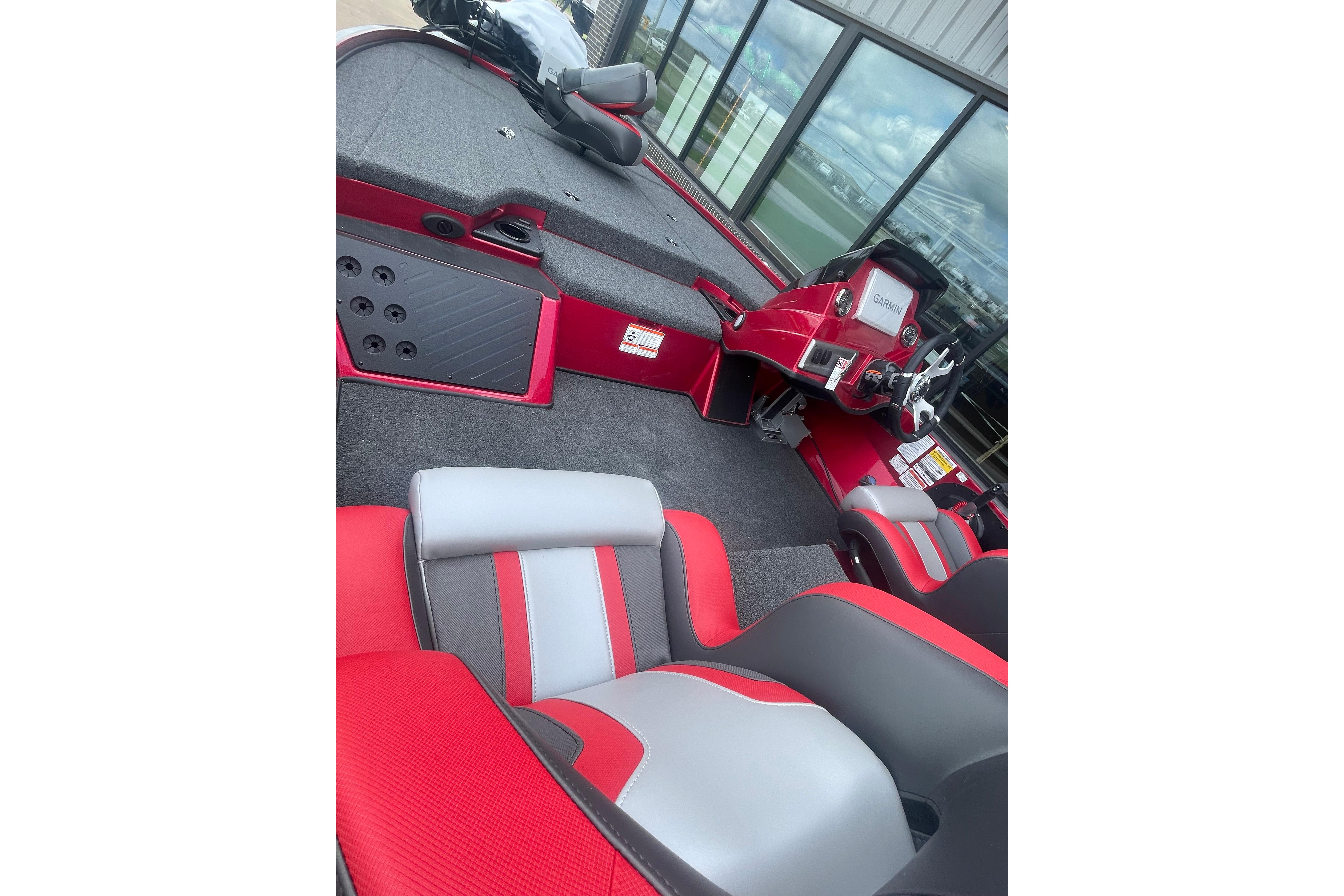 2026 Nitro Z18 Pro boat interior with red and gray seating, modern dashboard.