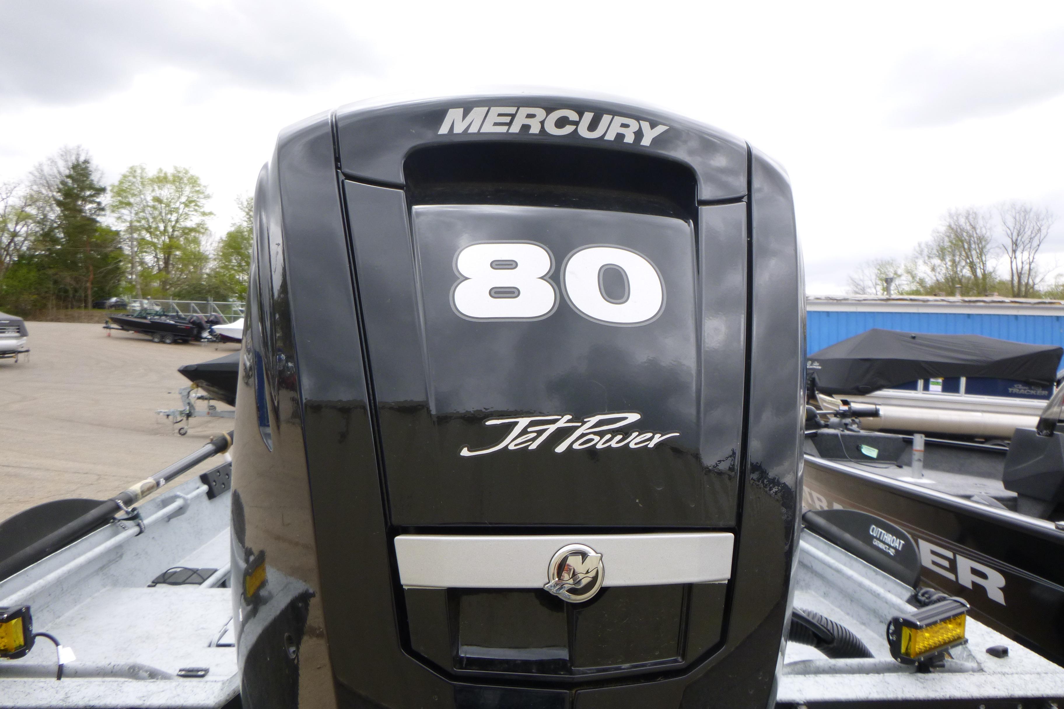 Mercury 80 JetPower engine on 2025 StealthCraft 16 StealthWeld boat, parked outdoors.