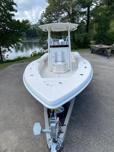 2024 Ranger 2600 Bay boat on trailer, parked near a scenic lake.