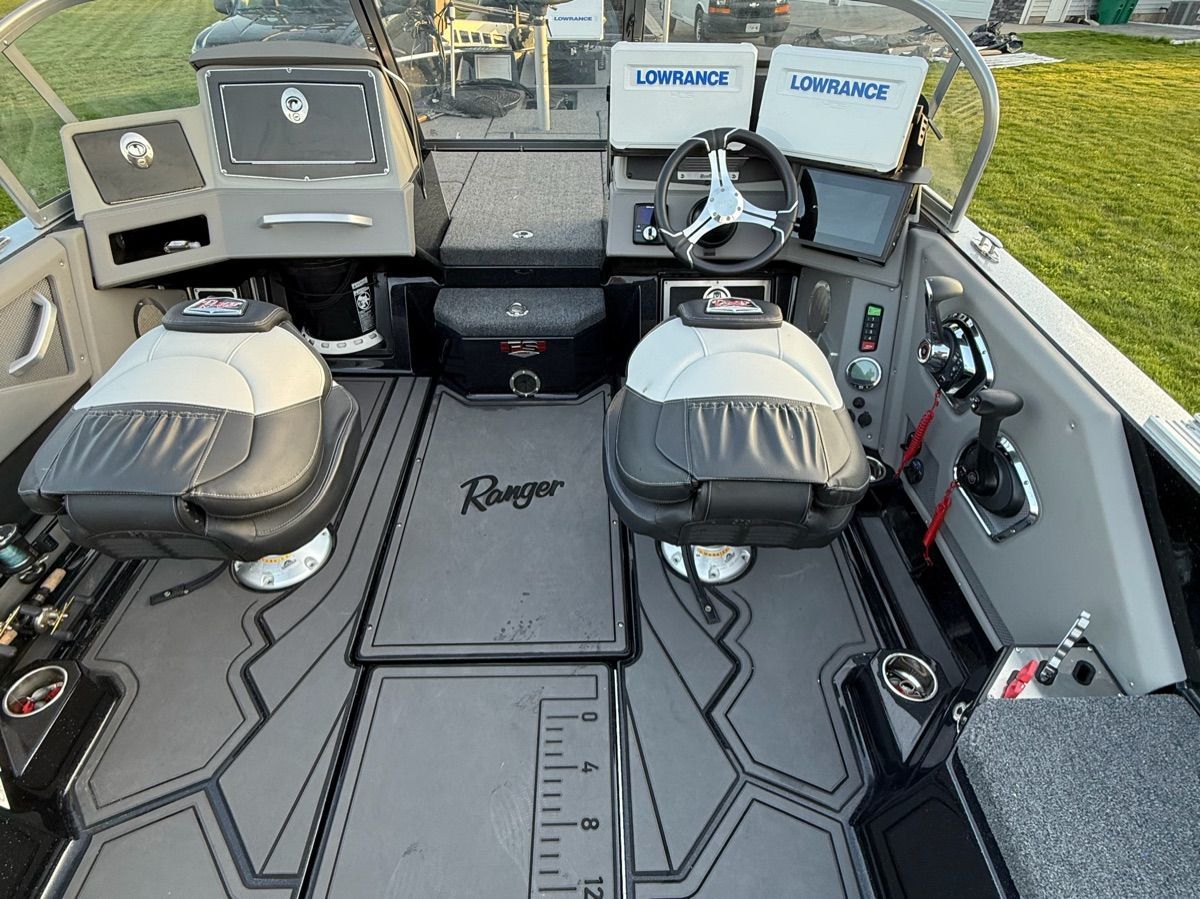 Interior of 2024 Ranger 622FS Pro with steering console and seats.