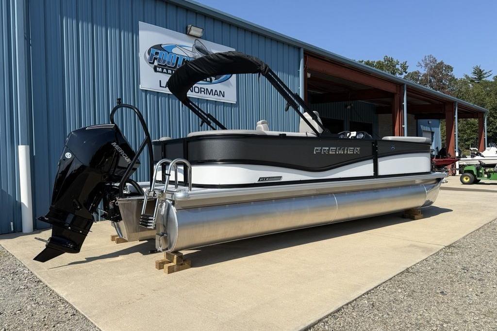 2026 Premier 220 Sunscape RF pontoon boat displayed outside a marine dealership.