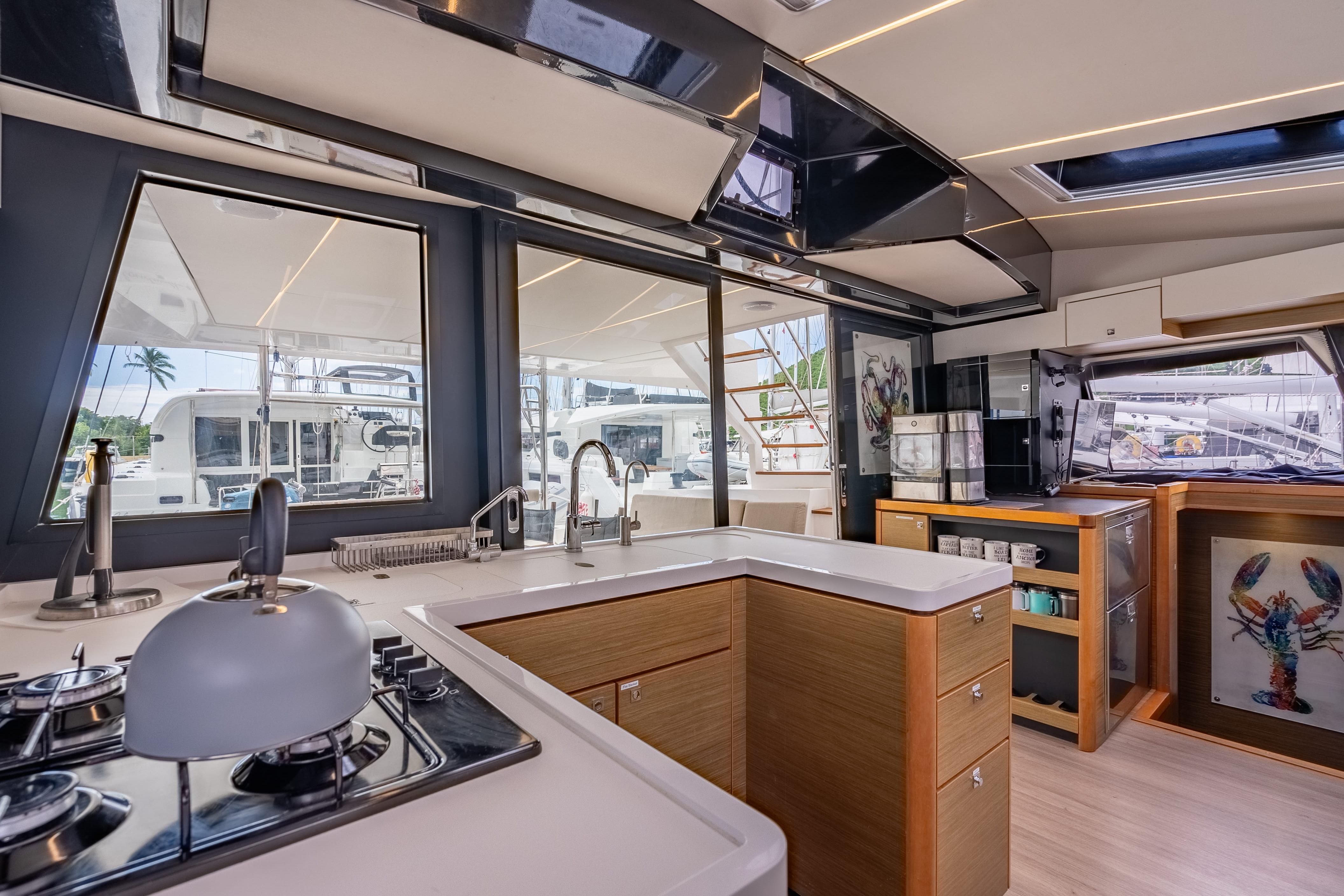 Modern kitchen interior of 2020 Nautitech 46 Fly catamaran with sleek design and ample natural light.