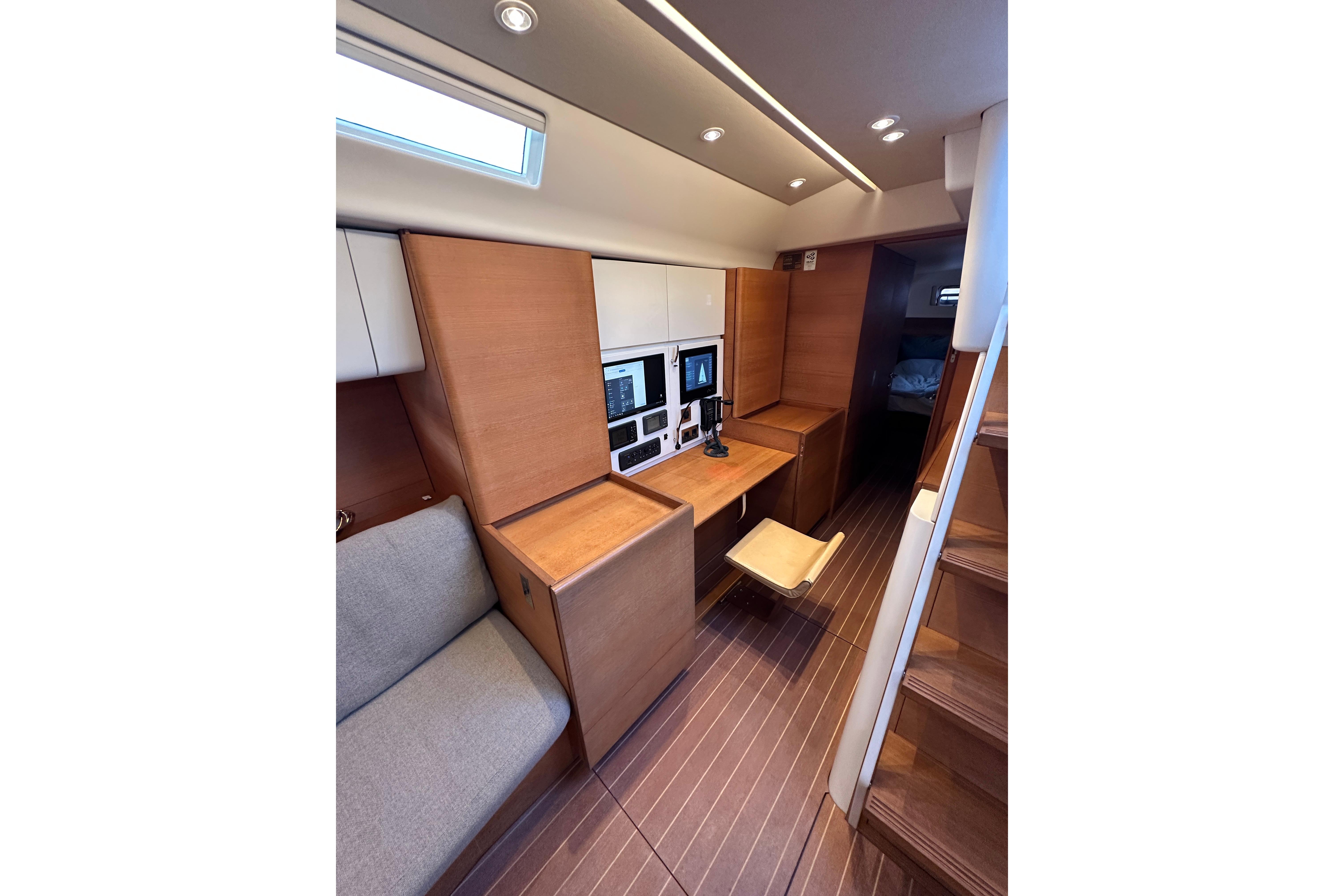 Luxurious interior of 2010 Nautor Swan 60 yacht with modern navigation station.
