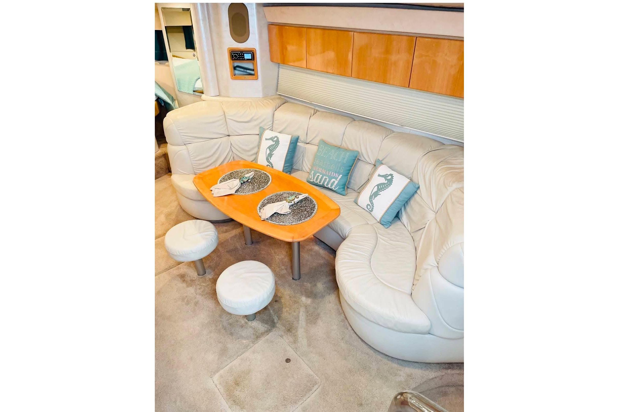 Luxurious interior of a 2003 Formula 40 Performance Cruiser with plush seating and decorative pillows.