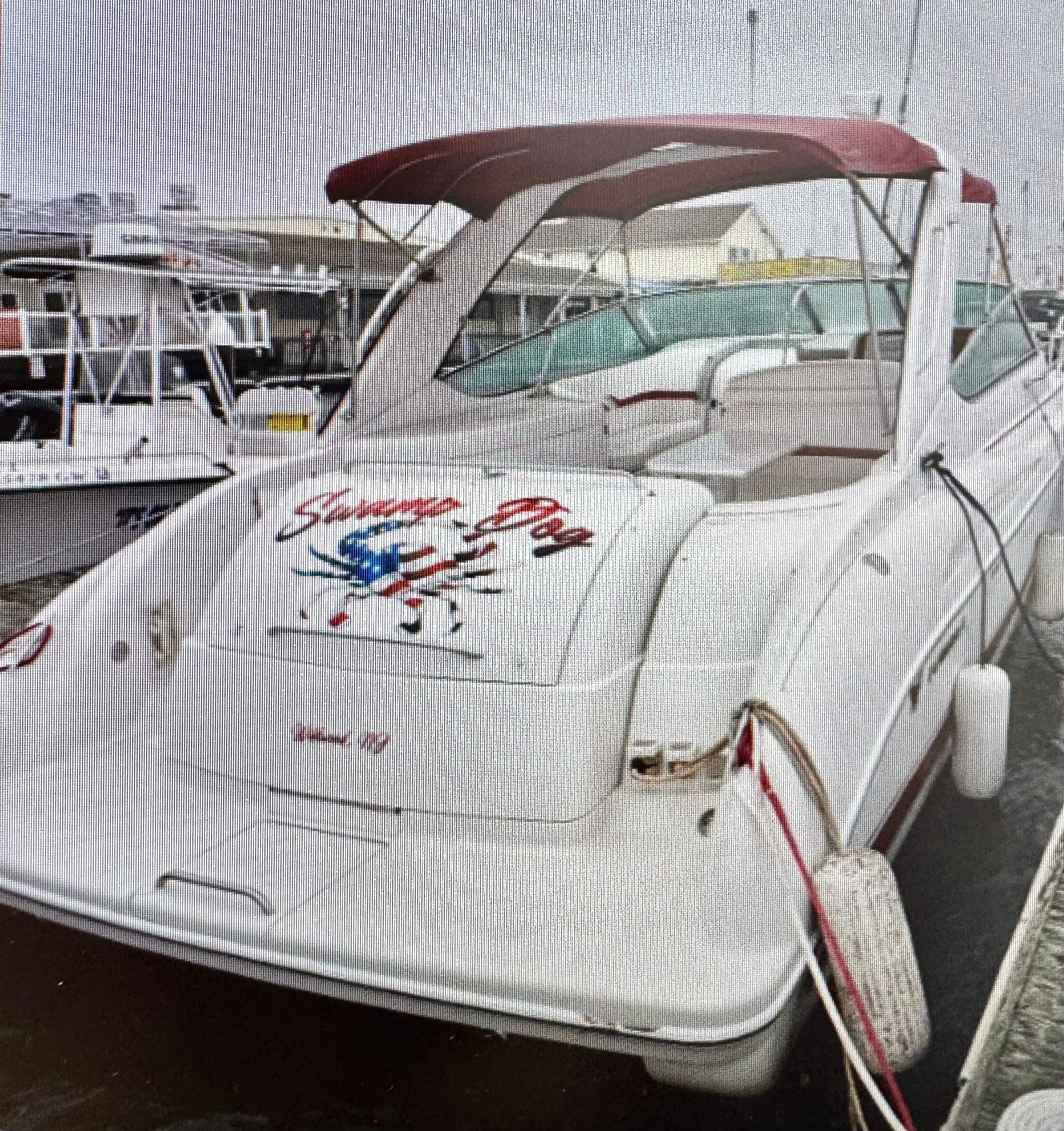 2001 Formula 37 Super Sport boat docked at harbor.