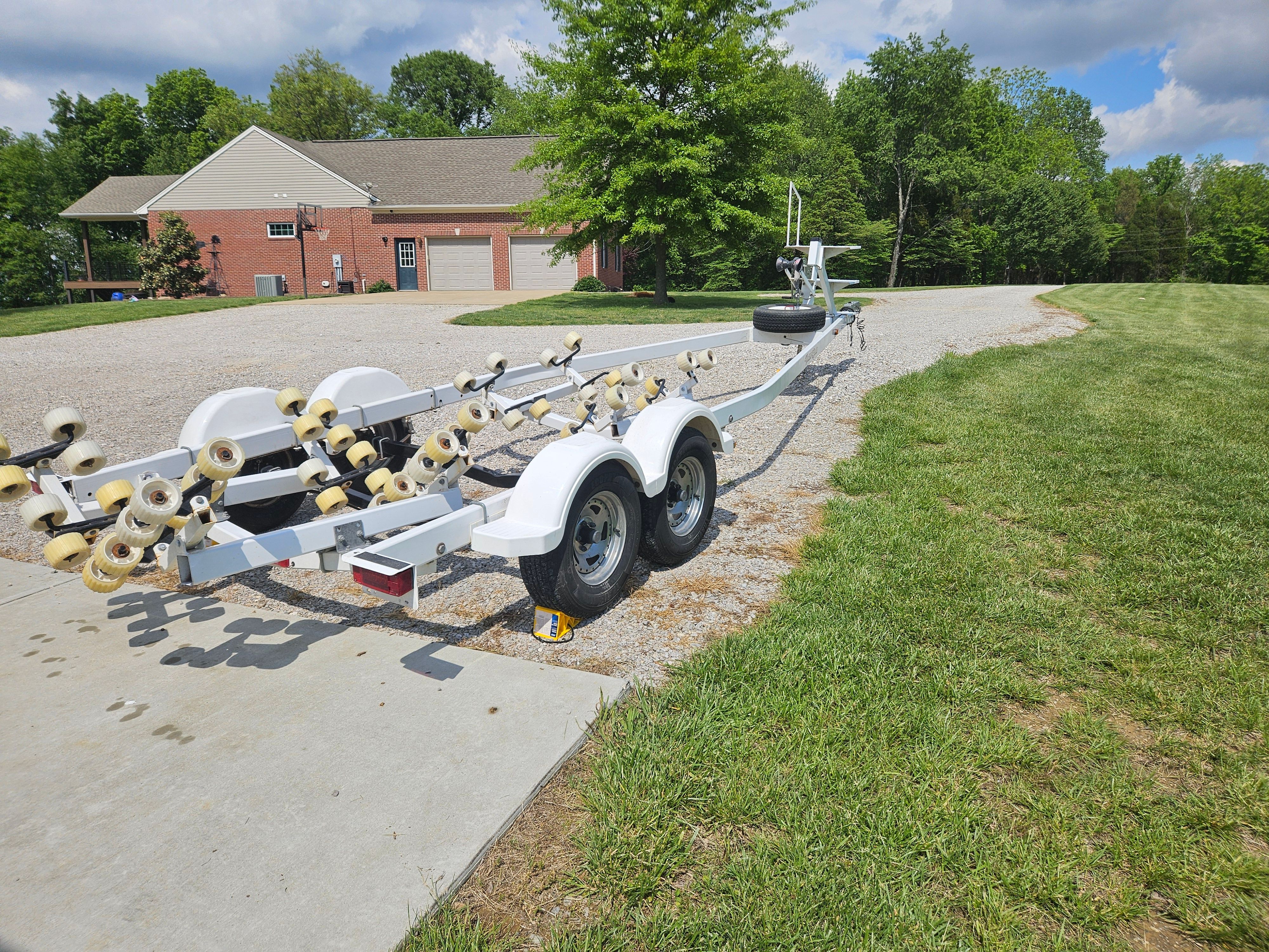Yacht Club R2466TB boat trailer on gravel path, 2010 model.