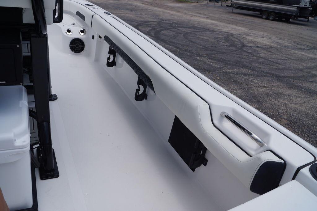 2027 Tidewater 2500 Carolina Bay boat interior with sleek white seating and storage compartments.