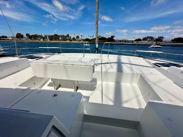 Bali 4.8 catamaran deck, 2021 model, with ocean view and clear blue sky.