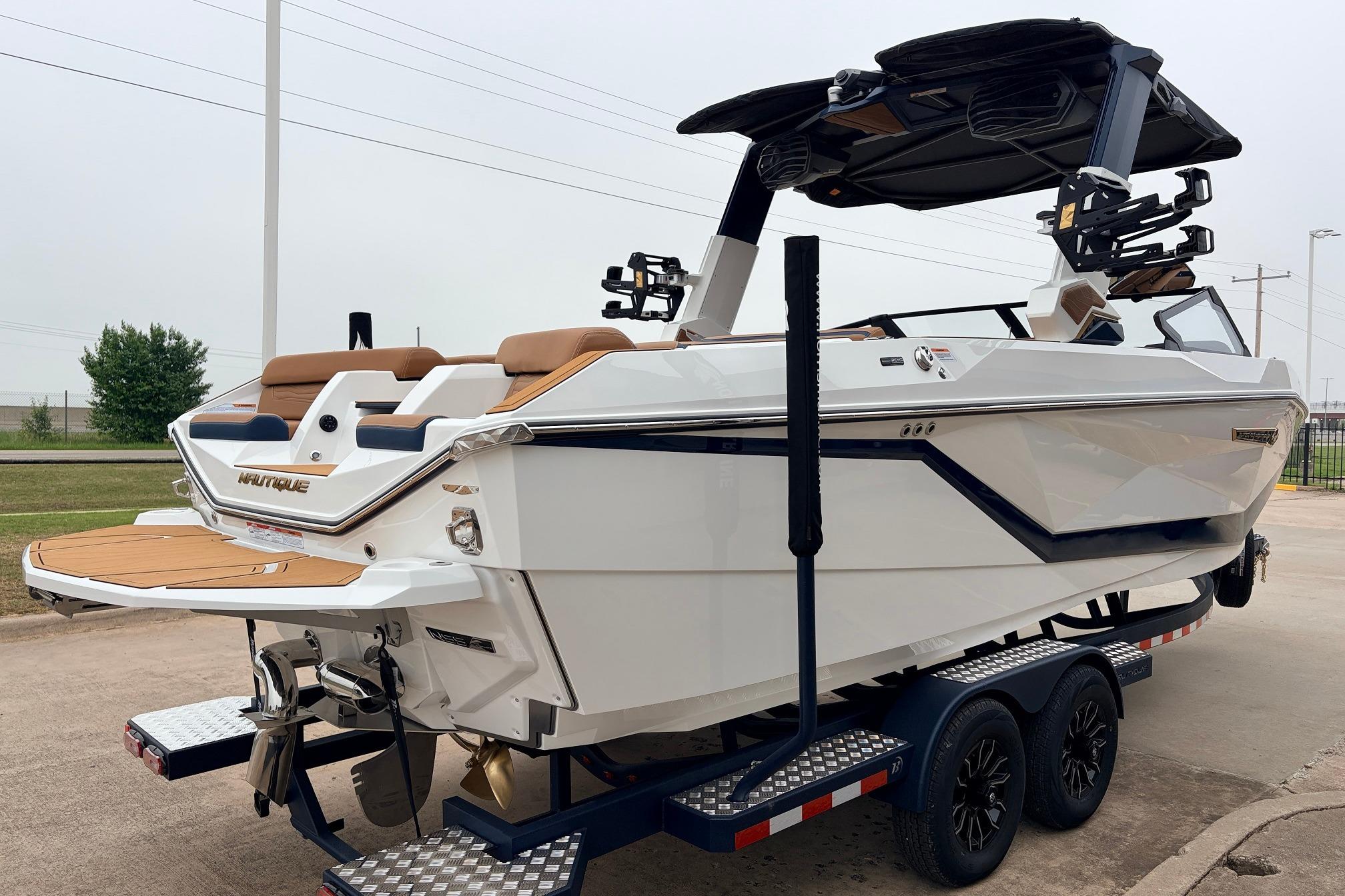 2026 Nautique Super Air Nautique G25 boat on trailer, showcasing sleek design and modern features.